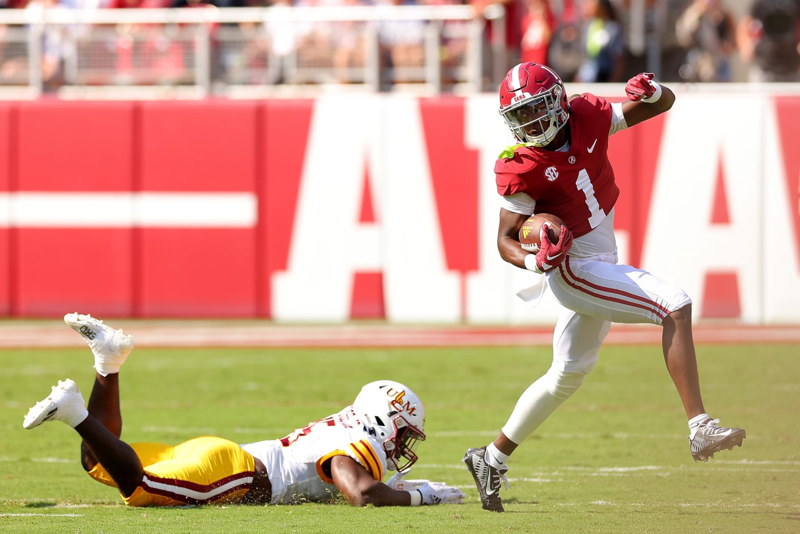 TUSCALOOSA, ALABAMA - SEPTEMBER 17: Kool-Aid McKinstry #1 of the Alabama Crimson Tide breaks a tackle by Carl Glass Jr. #35 of the Louisiana Monroe Warhawks on a punt return during the first quarter at Bryant-Denny Stadium on September 17, 2022 in Tuscaloosa, Alabama. (Photo by Kevin C. Cox/Getty Images) TUSCALOOSA, ALABAMA - SEPTEMBER 17: Kool-Aid McKinstry #1 of the Alabama Crimson Tide breaks a tackle by Carl Glass Jr. #35 of the Louisiana Monroe Warhawks on a punt return during the first quarter at Bryant-Denny Stadium on September 17, 2022 in Tuscaloosa, Alabama. (Photo by Kevin C. Cox/Getty Images)