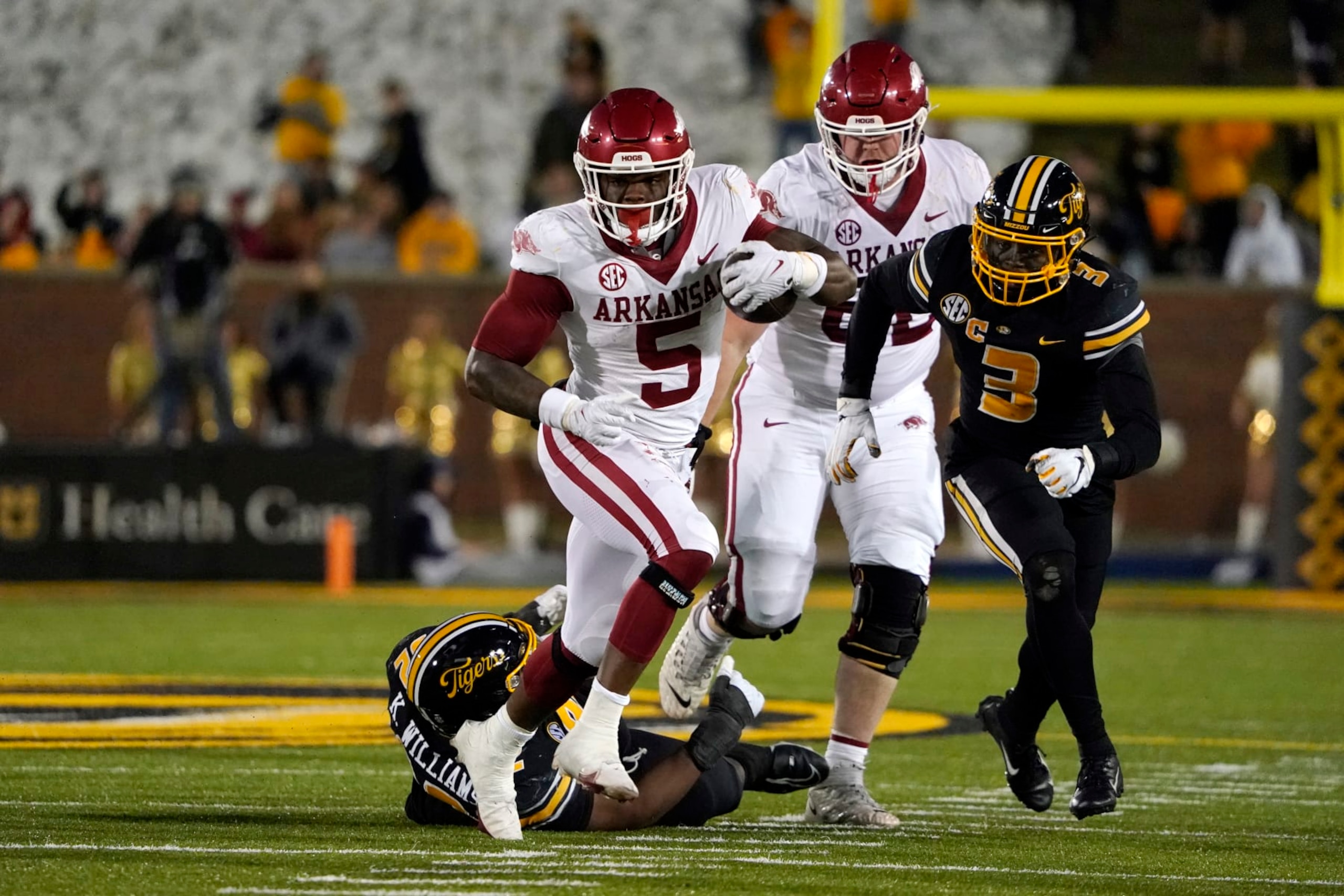 COLUMBIA, MISSOURI - NOVEMBER 25: Running back Raheim Sanders #5 of the Arkansas Razorbacks runs against the Missouri Tigers in the second half at Faurot Field/Memorial Stadium on November 25, 2022 in Columbia, Missouri. (Photo by Ed Zurga/Getty Images) COLUMBIA, MISSOURI - NOVEMBER 25: Running back Raheim Sanders #5 of the Arkansas Razorbacks runs against the Missouri Tigers in the second half at Faurot Field/Memorial Stadium on November 25, 2022 in Columbia, Missouri. (Photo by Ed Zurga/Getty Images)