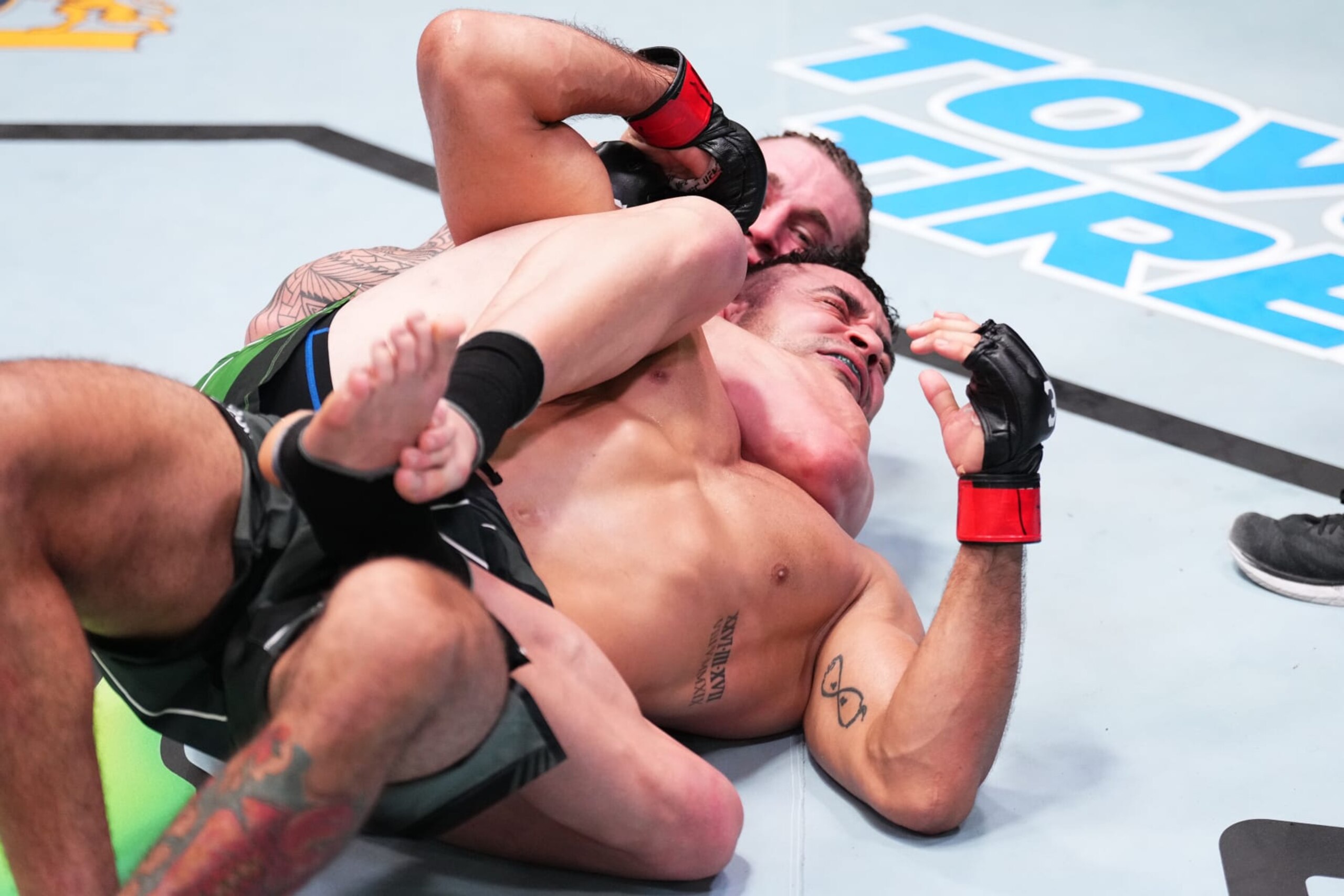 LAS VEGAS, NEVADA - FEBRUARY 25: (L-R) Brendan Allen secures a rear choke submission against Andre Muniz of Brazil in a middleweight fight during the UFC Fight Night event at UFC APEX on February 25, 2023 in Las Vegas, Nevada. (Photo by Chris Unger/Zuffa LLC via Getty Images)