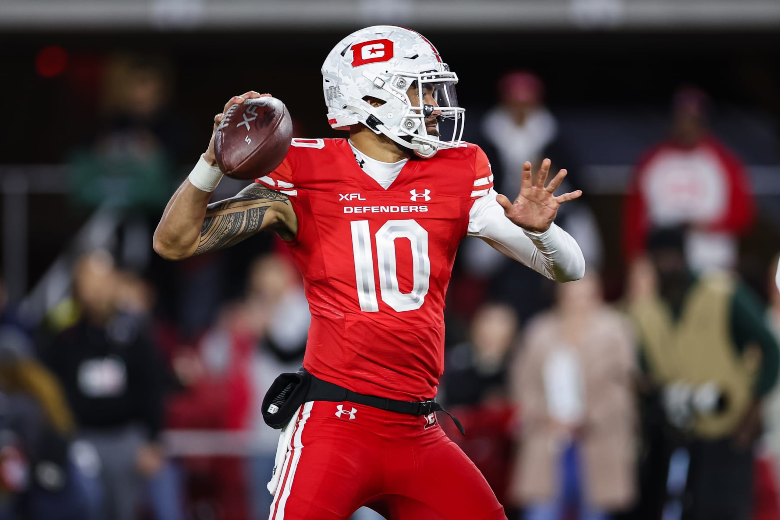 WASHINGTON, DC - FEBRUARY 19: Jordan Ta'amu #10 of the DC Defenders attempts a pass against the Seattle Sea Dragons during the first half of the XFL game at Audi Field on February 19, 2023 in Washington, DC. (Photo by Scott Taetsch/Getty Images)
