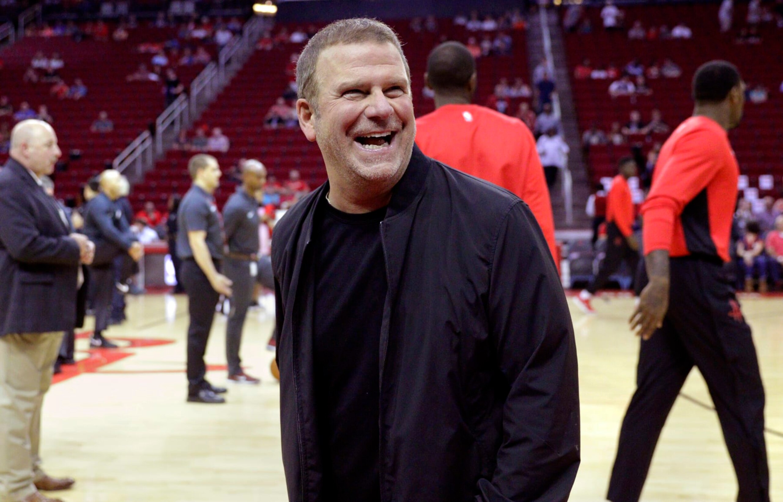 FILE - In this Oct. 13, 2017, file photo, new Houston Rockets owner Tilman Fertitta reacts before an NBA preseason basketball game against the San Antonio Spurs in Houston. Fertitta is interested in bringing an NHL hockey team to Houston, a possibility that did not exist under the NBA team’s previous regime. (AP Photo/Michael Wyke, File)