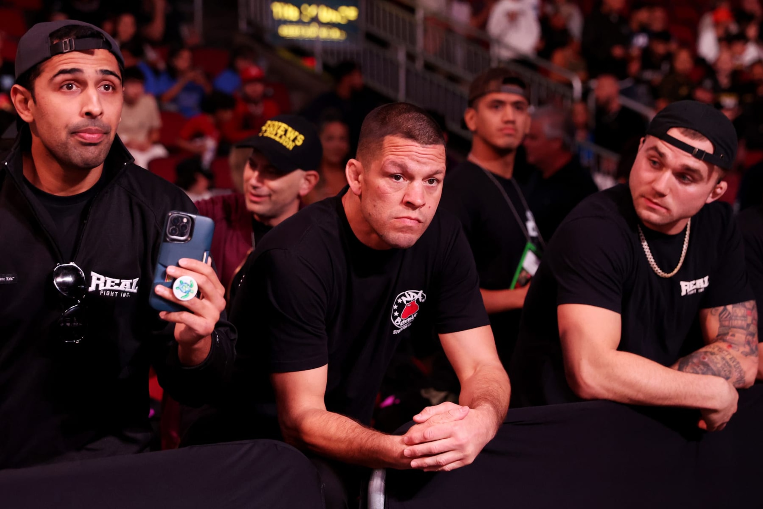 GLENDALE, ARIZONA - OCTOBER 29: MMA fighter Nate Diaz (C) attends the Jake Paul and Anderson Silva fight at Desert Diamond Arena on October 29, 2022 in Glendale, Arizona. (Photo by Christian Petersen/Getty Images) GLENDALE, ARIZONA - OCTOBER 29: MMA fighter Nate Diaz (C) attends the Jake Paul and Anderson Silva fight at Desert Diamond Arena on October 29, 2022 in Glendale, Arizona. (Photo by Christian Petersen/Getty Images)