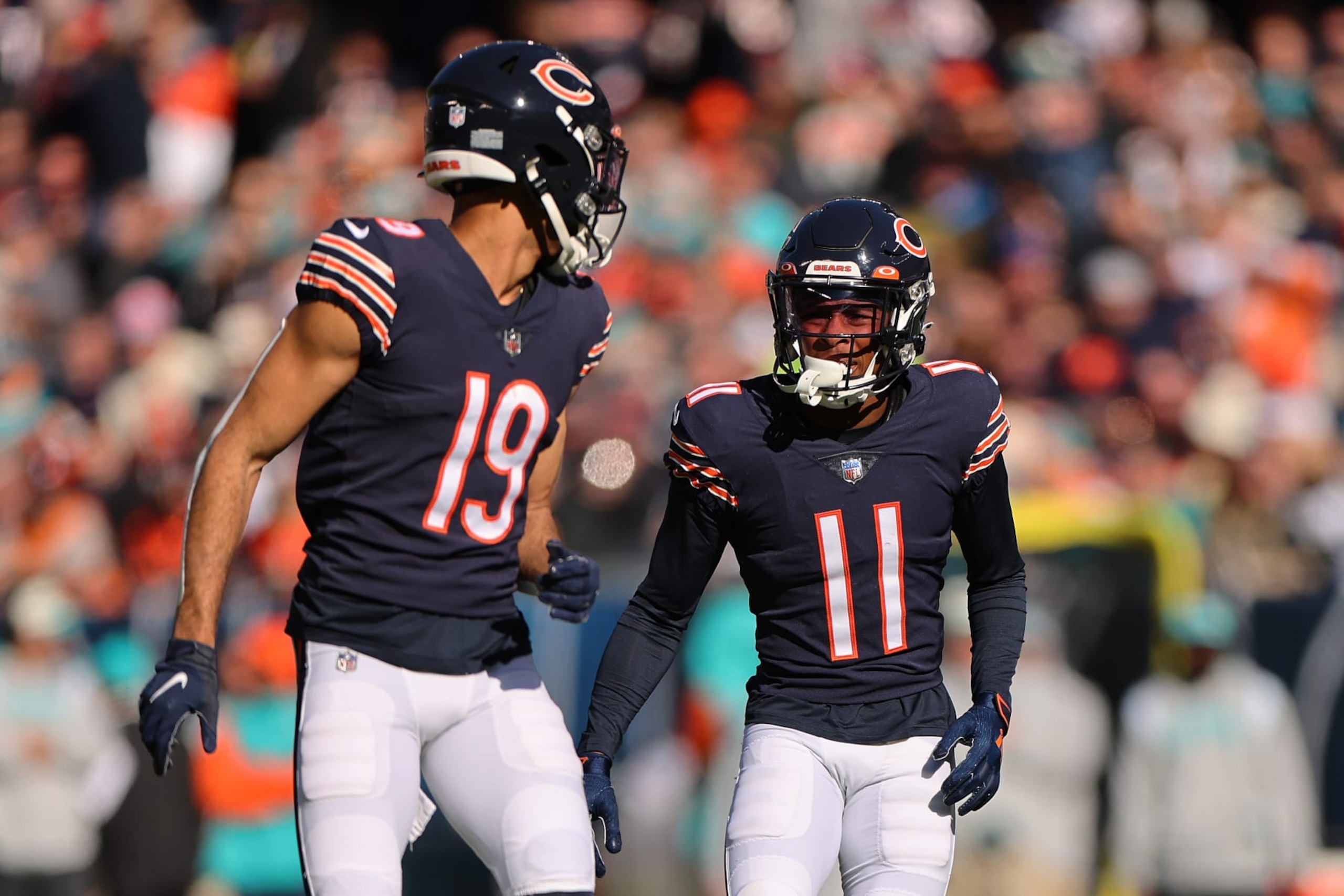 CHICAGO, ILLINOIS - NOVEMBER 06: Equanimeous St. Brown #19 and Darnell Mooney #11 of the Chicago Bears look on against the Miami Dolphins at Soldier Field on November 06, 2022 in Chicago, Illinois. (Photo by Michael Reaves/Getty Images)