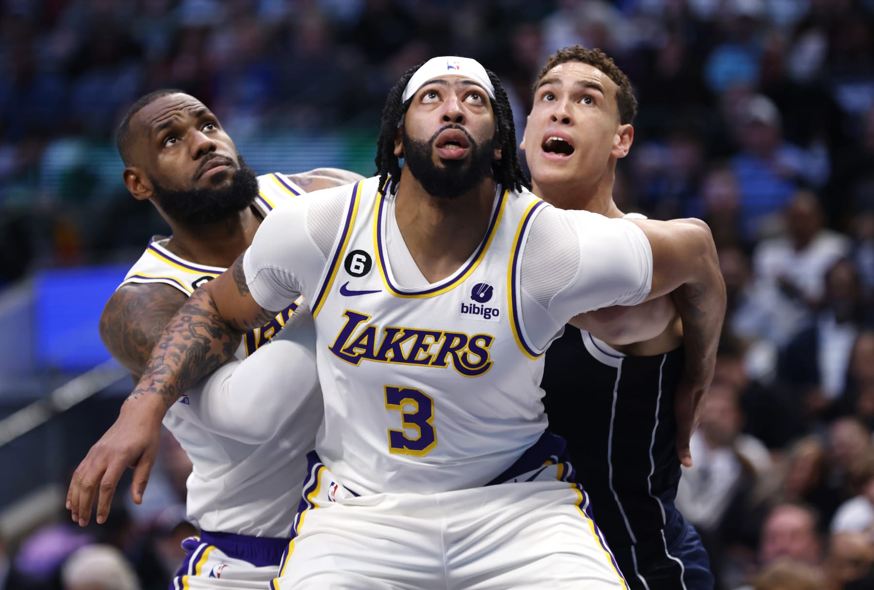 DALLAS, TX - FEBRUARY 26: Anthony Davis #3 and teammate LeBron James #6 of the Los Angeles Lakers box out Dwight Powell #7 of the Dallas Mavericks for a rebound in the first half of the game at American Airlines Center on February 26, 2023 in Dallas, Texas. NOTE TO USER: User expressly acknowledges and agrees that, by downloading and or using this photograph, User is consenting to the terms and conditions of the Getty Images License Agreement. (Photo by Ron Jenkins/Getty Images) DALLAS, TX - FEBRUARY 26: Anthony Davis #3 and teammate LeBron James #6 of the Los Angeles Lakers box out Dwight Powell #7 of the Dallas Mavericks for a rebound in the first half of the game at American Airlines Center on February 26, 2023 in Dallas, Texas. NOTE TO USER: User expressly acknowledges and agrees that, by downloading and or using this photograph, User is consenting to the terms and conditions of the Getty Images License Agreement. (Photo by Ron Jenkins/Getty Images)