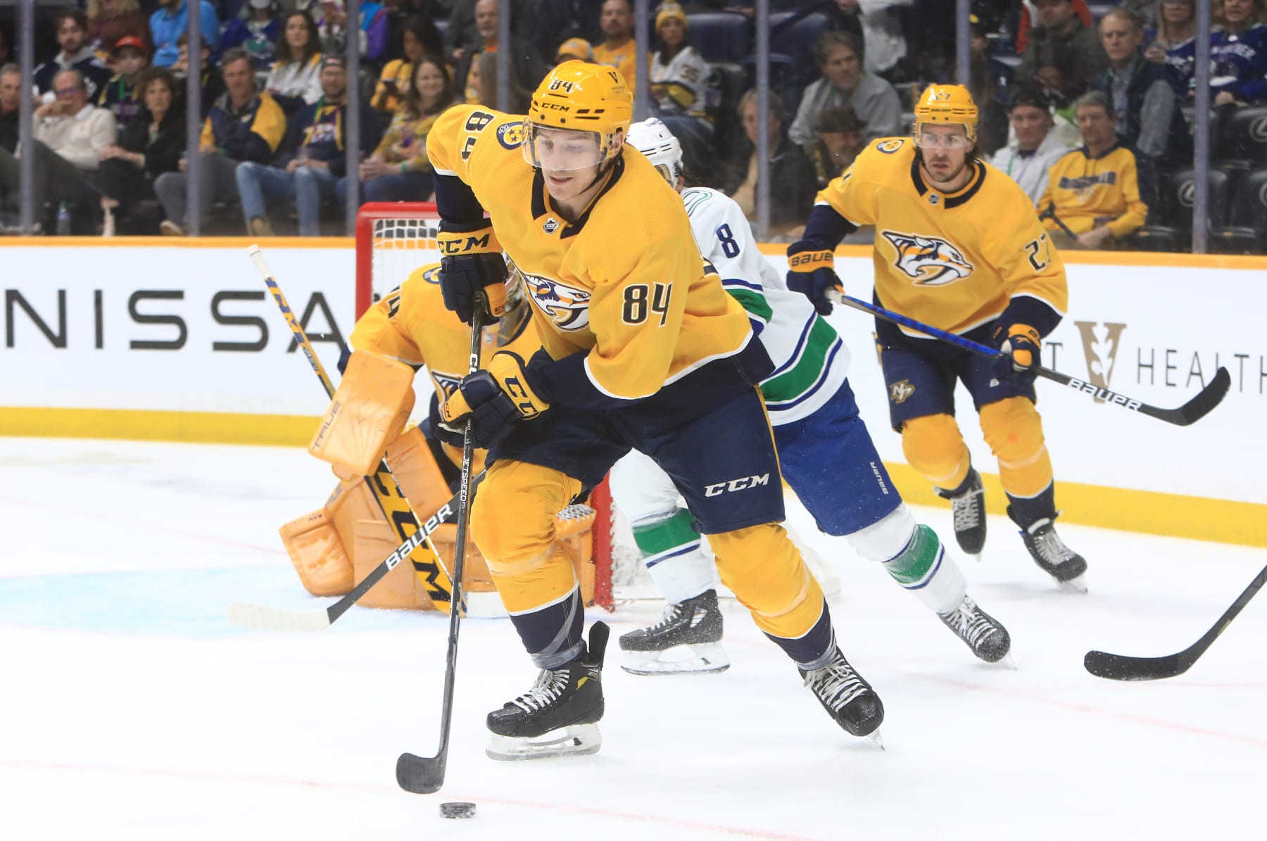 NASHVILLE, TN - FEBRUARY 21: Nashville Predators left wing Tanner Jeannot (84) skates with the puck during the NHL game between the Nashville Predators and Vancouver Canucks, held on February 21, 2023, at Bridgestone Arena in Nashville, Tennessee. (Photo by Danny Murphy/Icon Sportswire via Getty Images) NASHVILLE, TN - FEBRUARY 21: Nashville Predators left wing Tanner Jeannot (84) skates with the puck during the NHL game between the Nashville Predators and Vancouver Canucks, held on February 21, 2023, at Bridgestone Arena in Nashville, Tennessee. (Photo by Danny Murphy/Icon Sportswire via Getty Images)