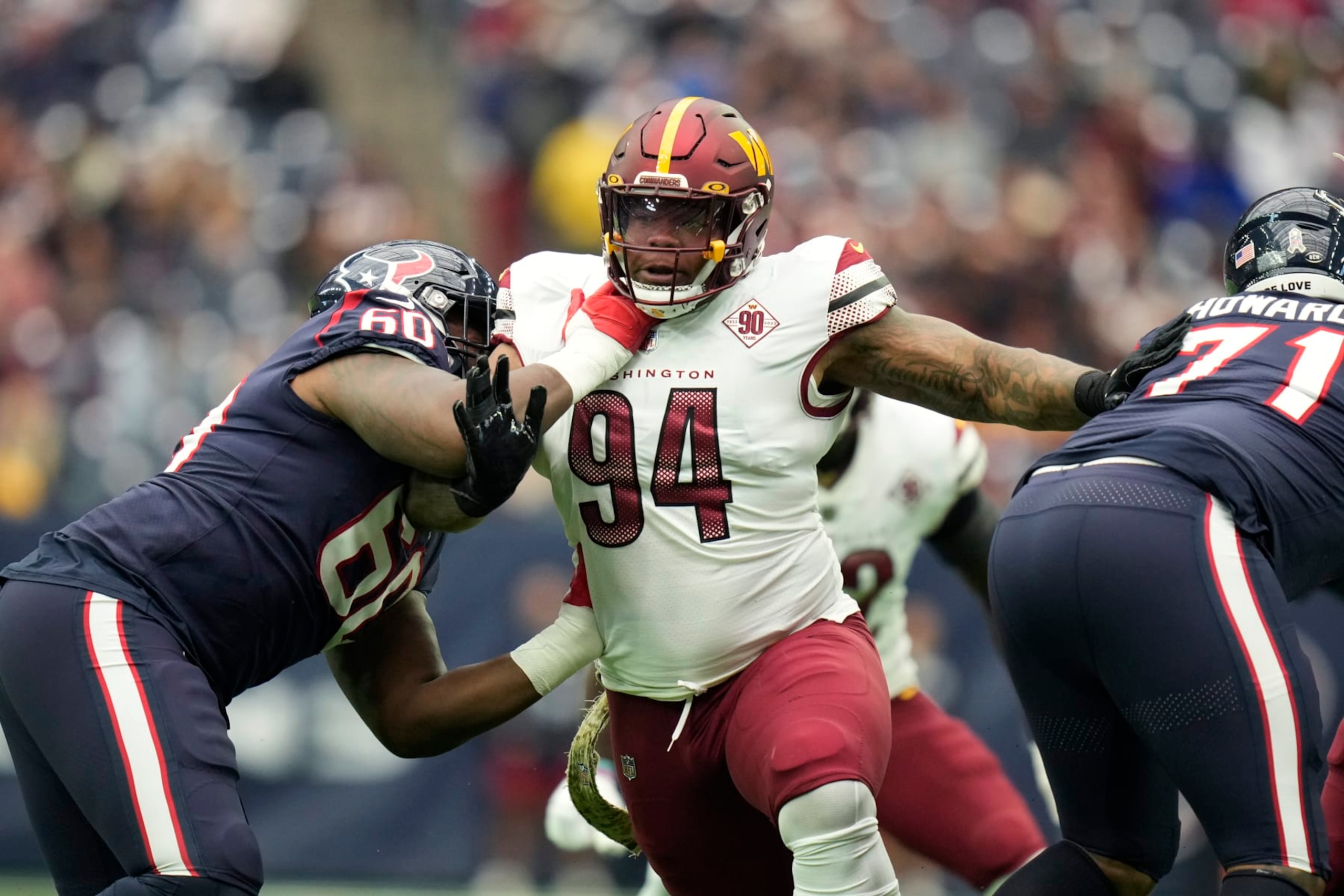 Washington Commanders defensive tackle Daron Payne (94) runs against Houston Texans guard A.J. Cann (60) during the first half of an NFL football game Sunday, Nov. 20, 2022, in Houston. (AP Photo/Eric Christian Smith)