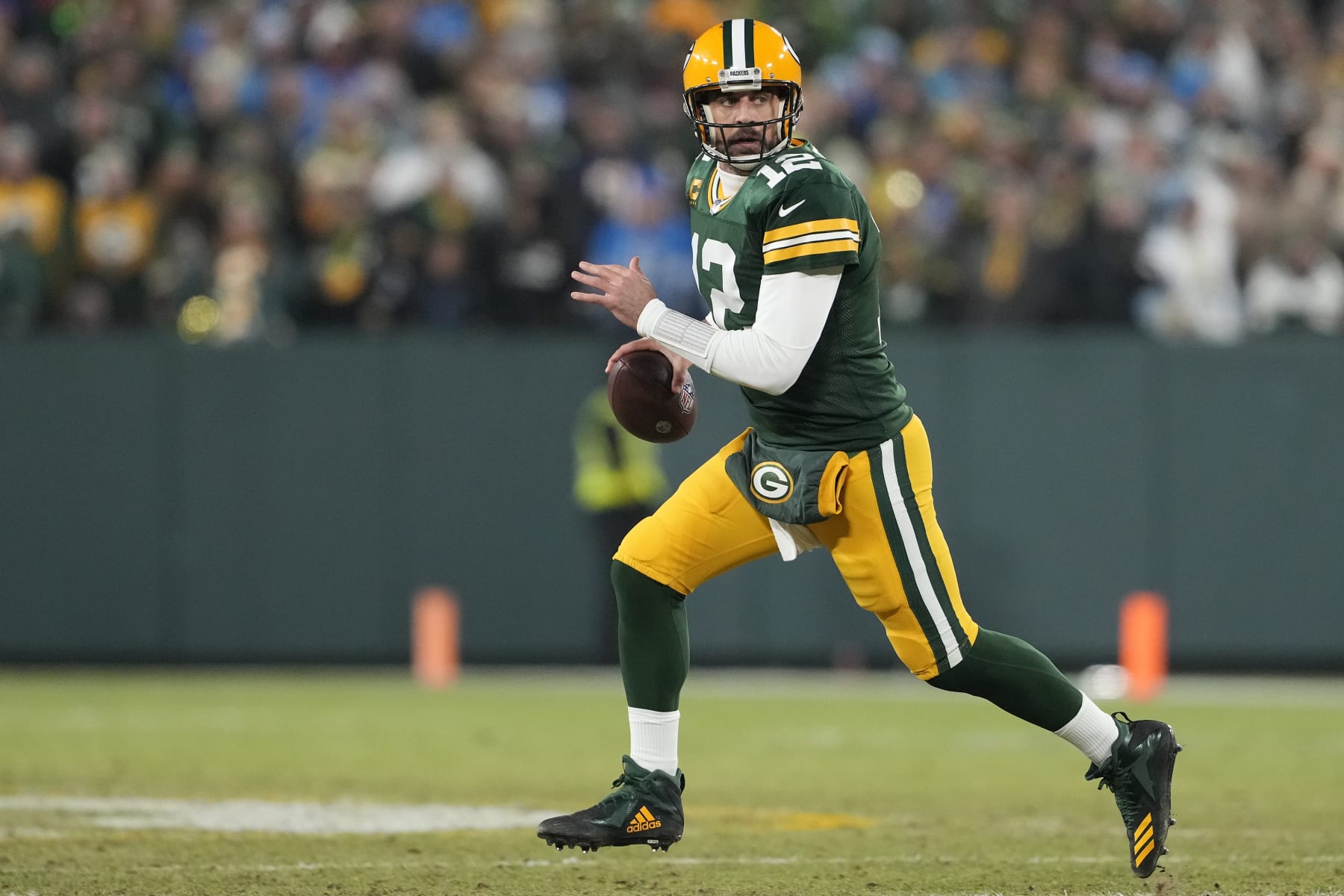 GREEN BAY, WISCONSIN - JANUARY 08: Aaron Rodgers #12 of the Green Bay Packers looks to throw a pass against the Detroit Lions in the first half at Lambeau Field on January 08, 2023 in Green Bay, Wisconsin. (Photo by Patrick McDermott/Getty Images)