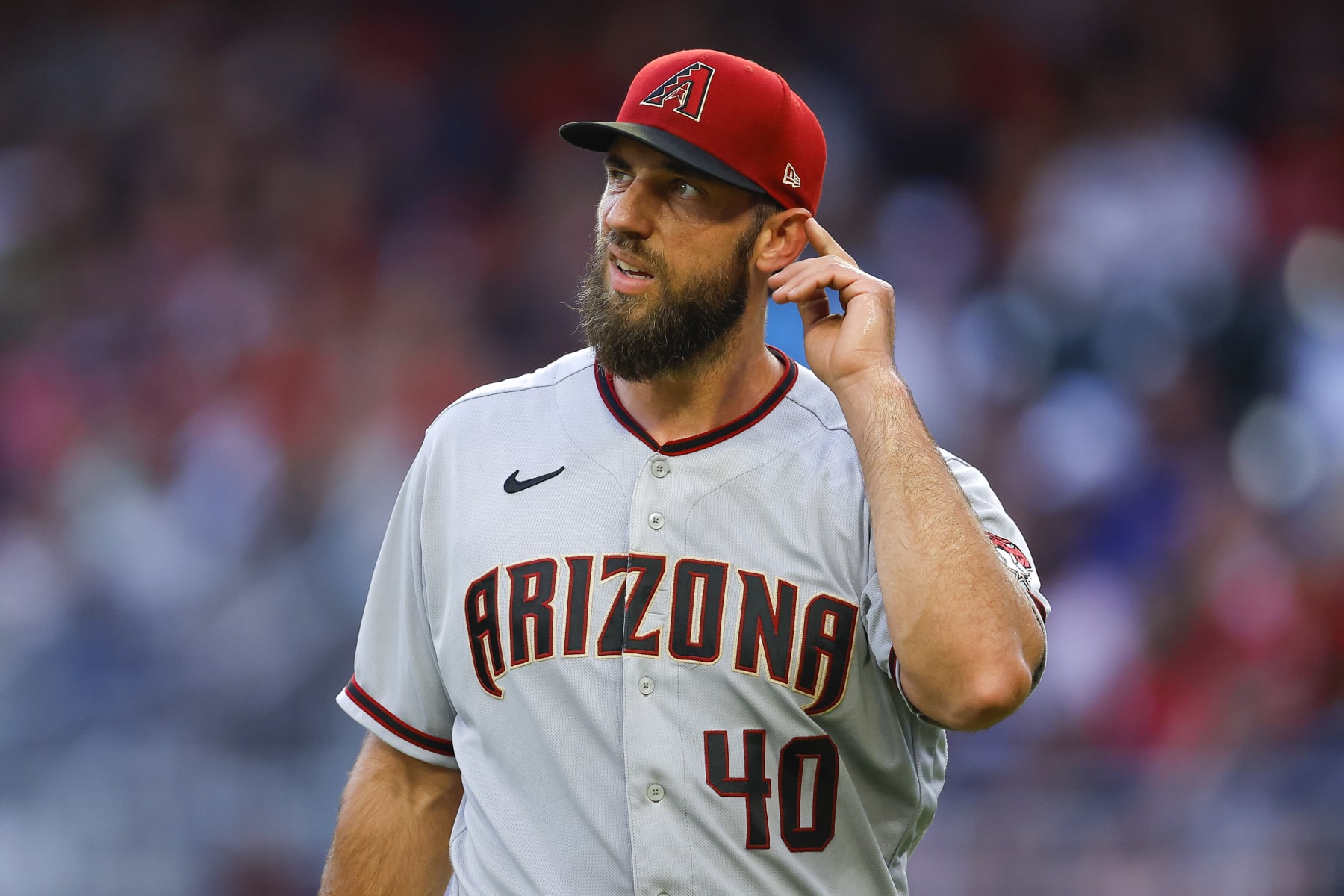 ATLANTA, GA - JULY 29: Madison Bumgarner #40 of the Arizona Diamondbacks reacts at the end of the third inning against the Atlanta Braves at Truist Park on July 29, 2022 in Atlanta, Georgia. (Photo by Todd Kirkland/Getty Images)