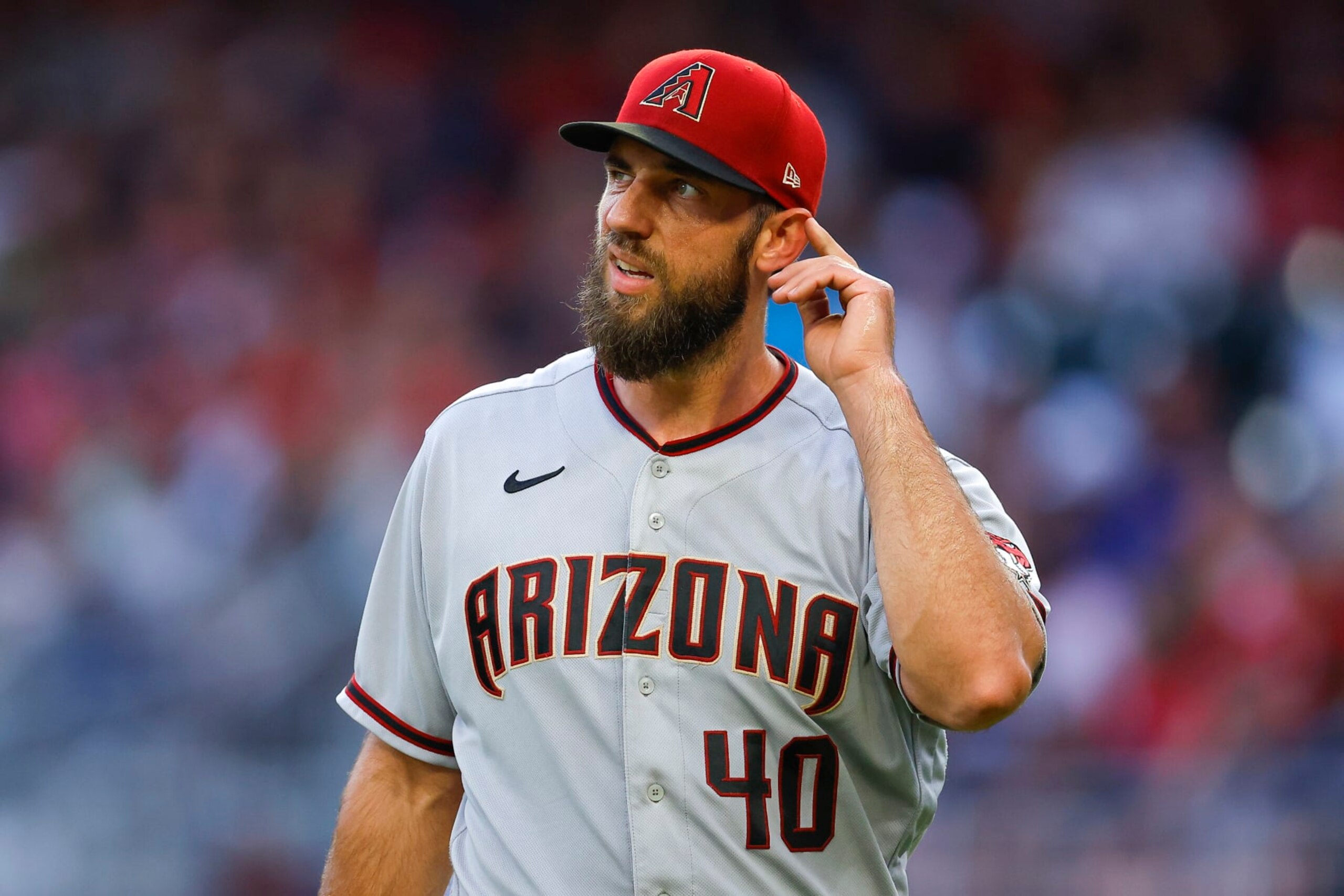 ATLANTA, GA - JULY 29: Madison Bumgarner #40 of the Arizona Diamondbacks reacts at the end of the third inning against the Atlanta Braves at Truist Park on July 29, 2022 in Atlanta, Georgia. (Photo by Todd Kirkland/Getty Images)