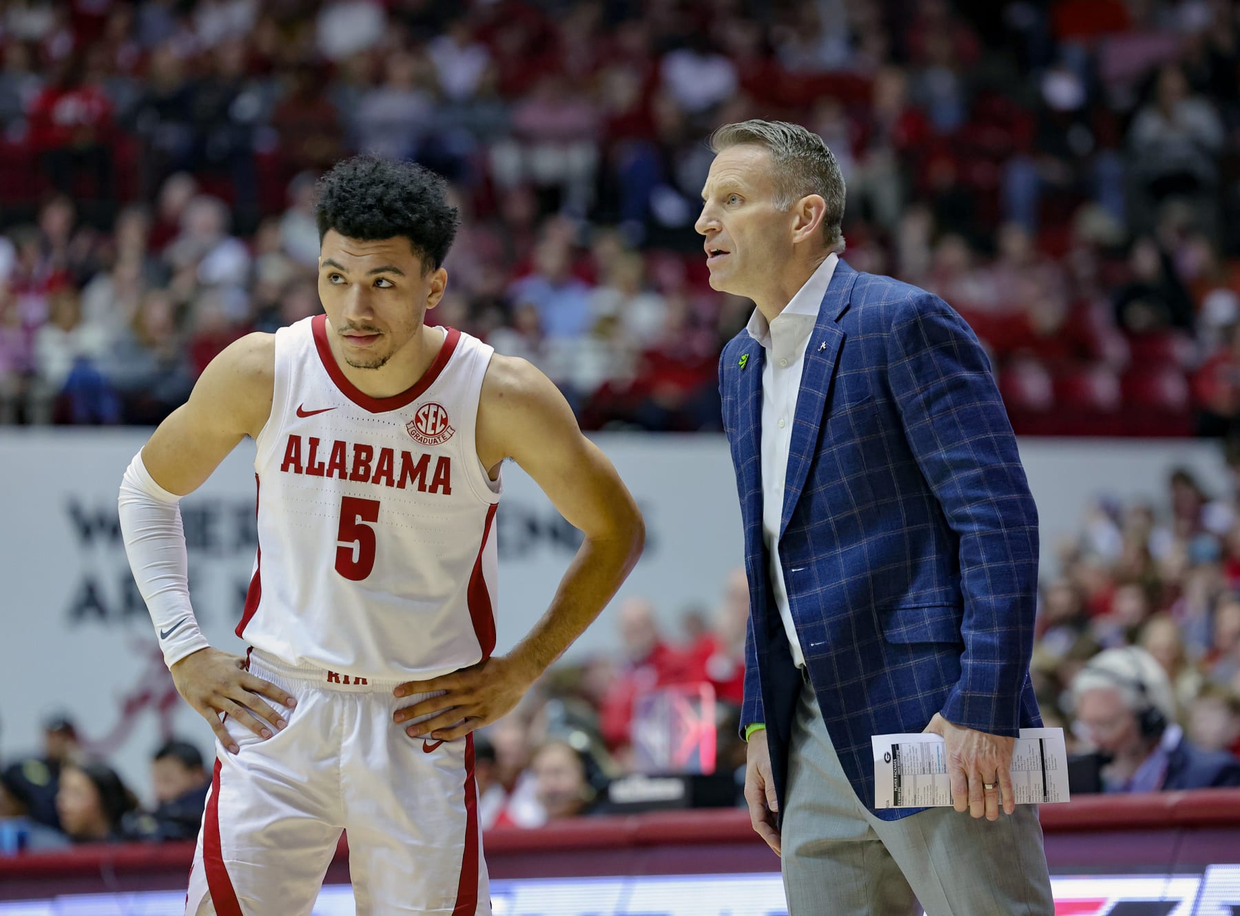 TUSCALOOSA, AL - FEBRUARY 18: Jahvon Quinerly #5 of the Alabama Crimson Tide gets first half instructions from head coach Nate Oats during a time out against the Georgia Bulldogs at Coleman Coliseum on February 18, 2023 in Tuscaloosa, Alabama. (Photo by Brandon Sumrall/Getty Images)