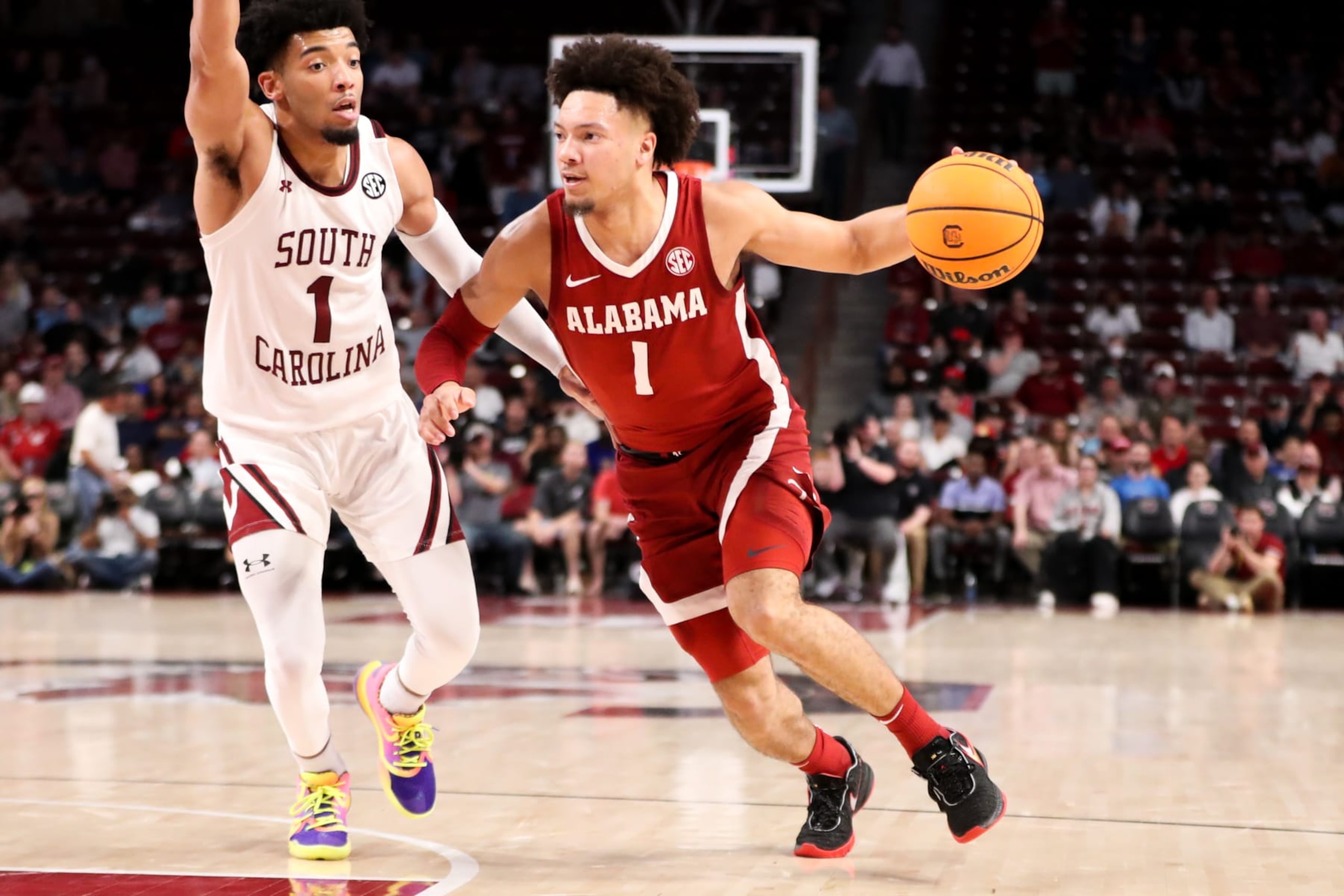 COLUMBIA, SC - FEBRUARY 22: Jacobi Wright (1) of the South Carolina Gamecocks defends Mark Sears (1) of the Alabama Crimson Tide as he drives to the basket during a basketball game on February 22, 2023 at Colonial Life Arena in Columbia, SC. (Photo by David Jensen/Icon Sportswire via Getty Images)