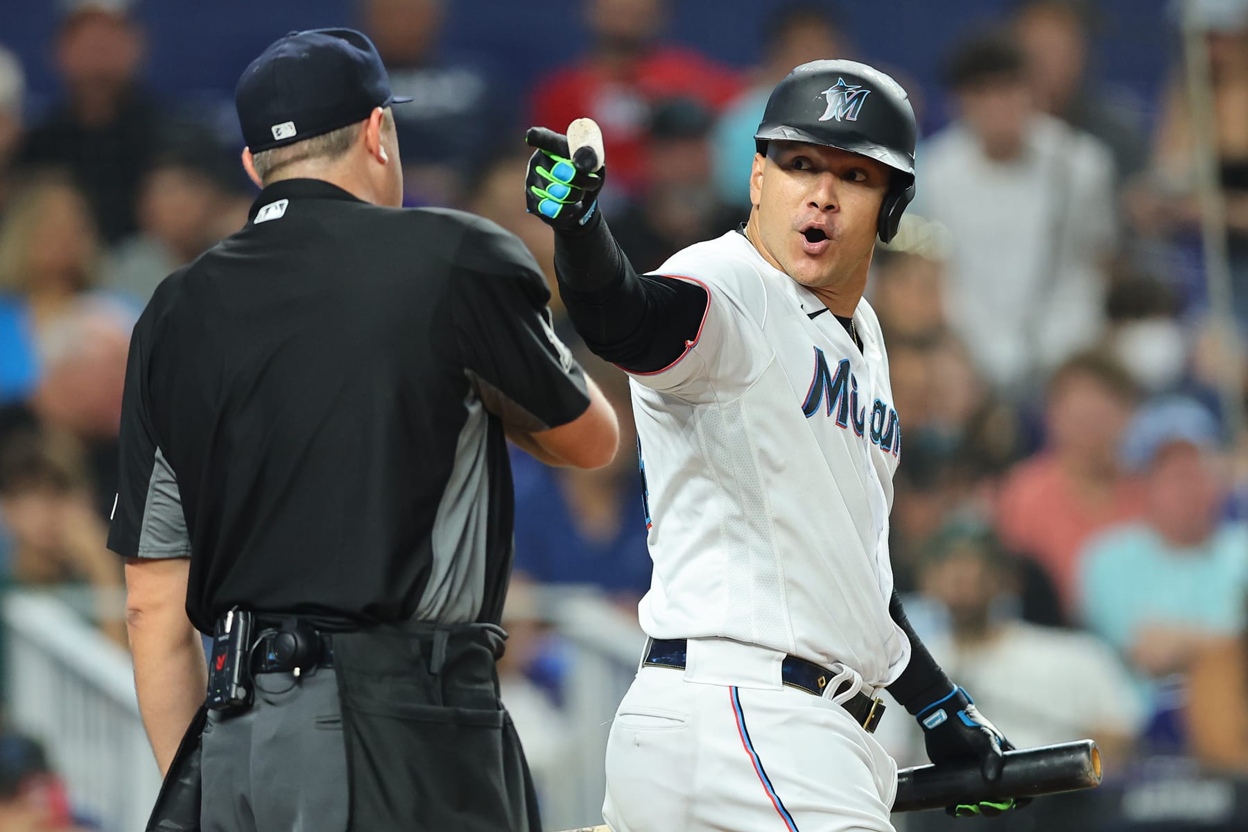 MIAMI, FLORIDA - JULY 05: Avisail Garcia #24 of the Miami Marlins argues a strike three call with home plate umpire Lance Barrett #16 during the fourth inning against the Los Angeles Angels at loanDepot park on July 05, 2022 in Miami, Florida. (Photo by Michael Reaves/Getty Images)