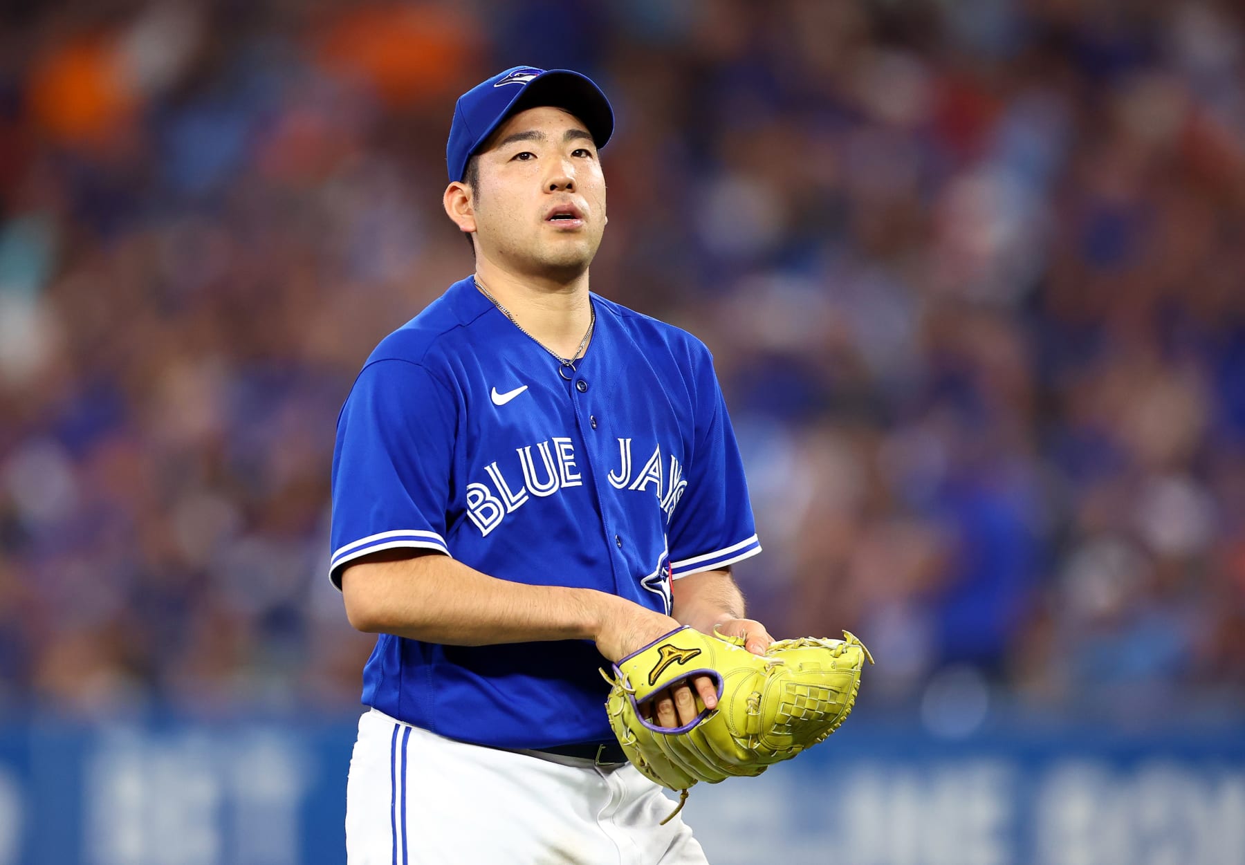 TORONTO, ON - SEPTEMBER 30:  Yusei Kikuchi #16 of the Toronto Blue Jays walks to the dugout against the Boston Red Sox at Rogers Centre on September 30, 2022 in Toronto, Ontario, Canada.  (Photo by Vaughn Ridley/Getty Images)