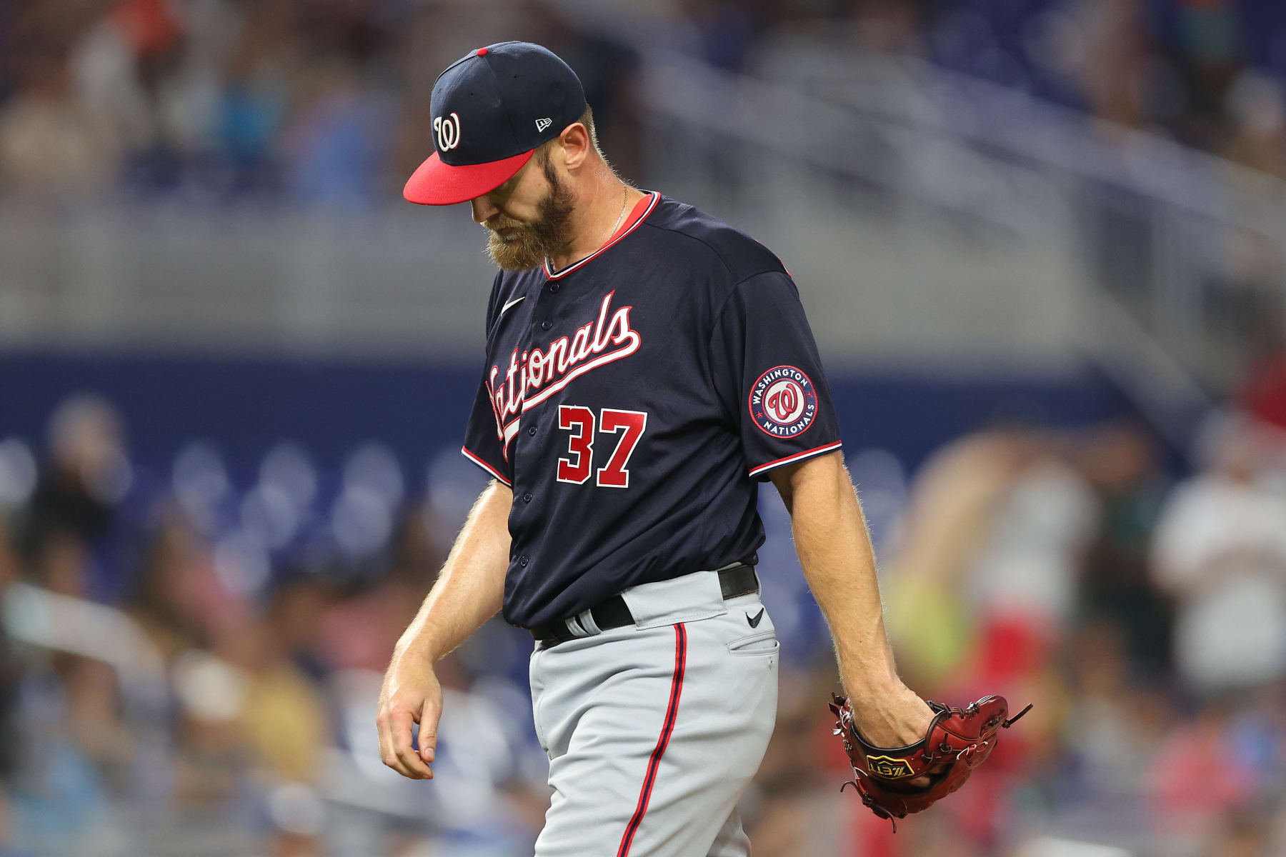 MIAMI, FLORIDA - JUNE 09: Stephen Strasburg #37 of the Washington Nationals reacts as he is taken out of the game by manager Dave Martinez #4 during the fifth inning against the Miami Marlins at loanDepot park on June 09, 2022 in Miami, Florida. (Photo by Michael Reaves/Getty Images)