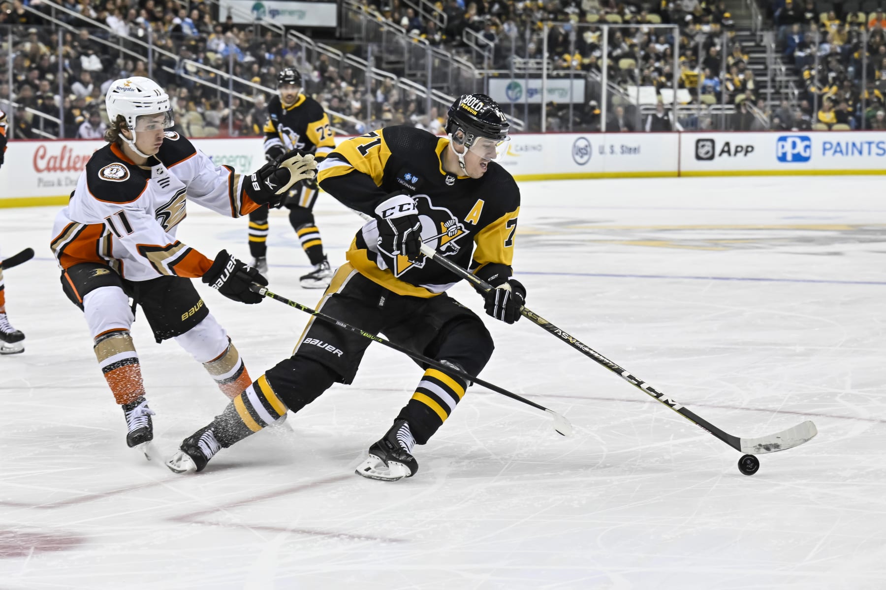 Anaheim Ducks center Trevor Zegras and Pittsburgh Penguins center Evgeni Malkin