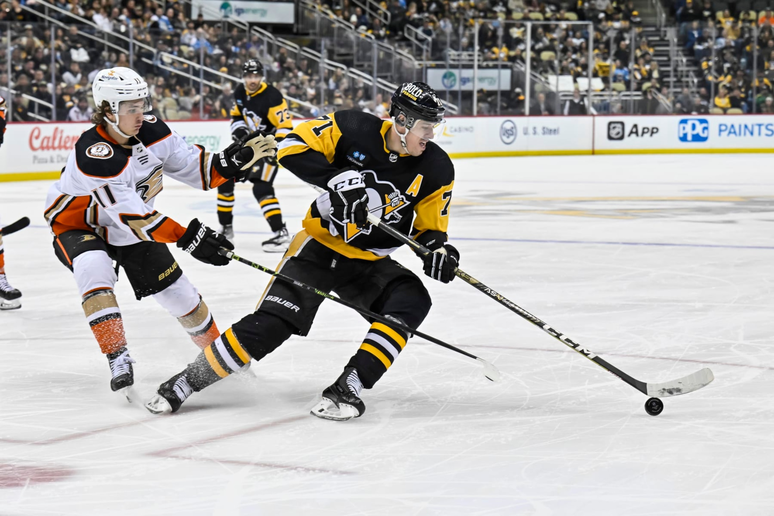 Anaheim Ducks center Trevor Zegras and Pittsburgh Penguins center Evgeni Malkin