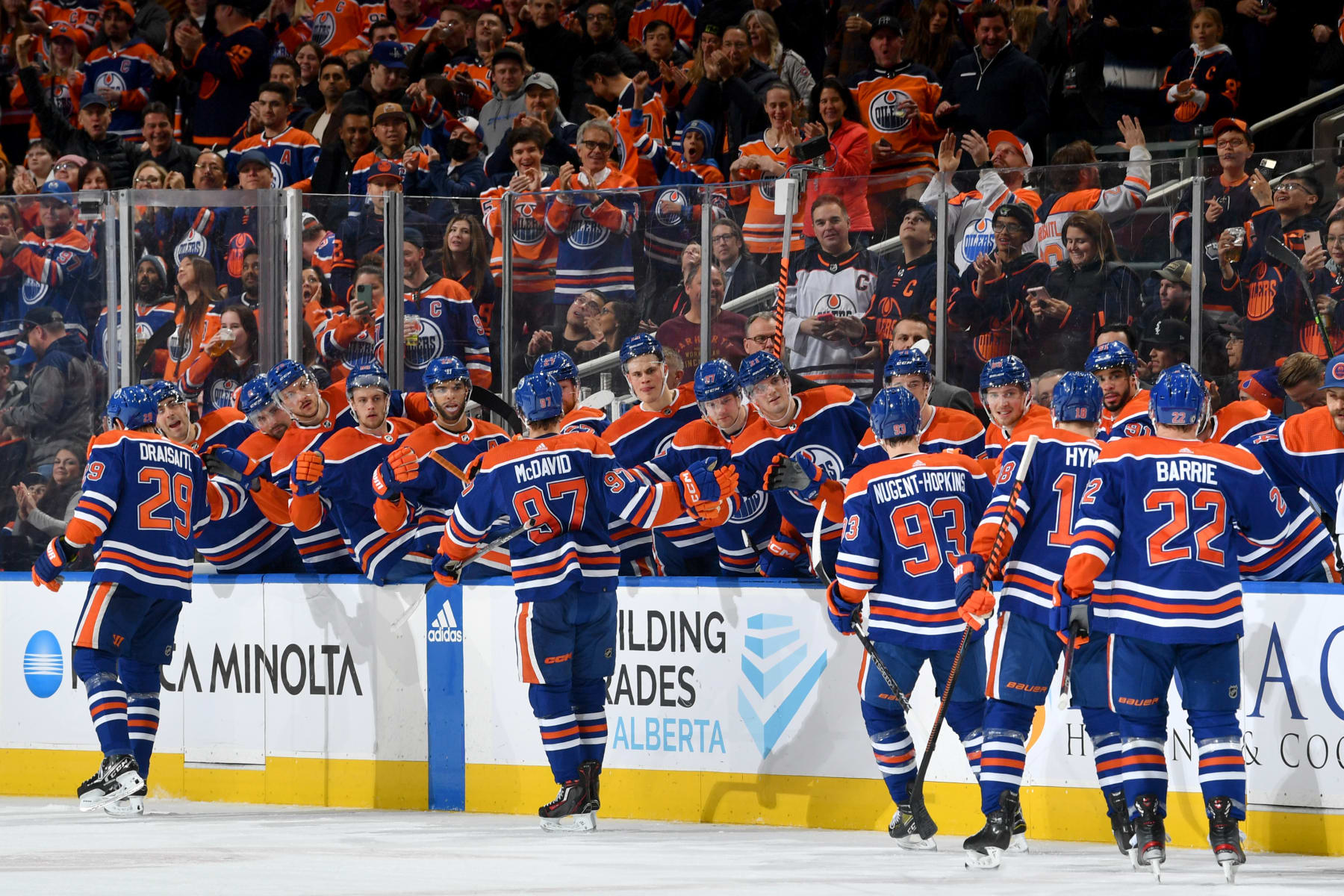 EDMONTON, CANADA - JANUARY 19: Leon Draisaitl #29, Connor McDavid #97, Ryan Nugent-Hopkins #93, Zach Hyman #18 and Tyson Barrie #22 of the Edmonton Oilers celebrate after a first period goal against the Tampa Bay Lightning at the bench during the game on January 19, 2023 at Rogers Place in Edmonton, Alberta, Canada. (Photo by Andy Devlin/NHLI via Getty Images)