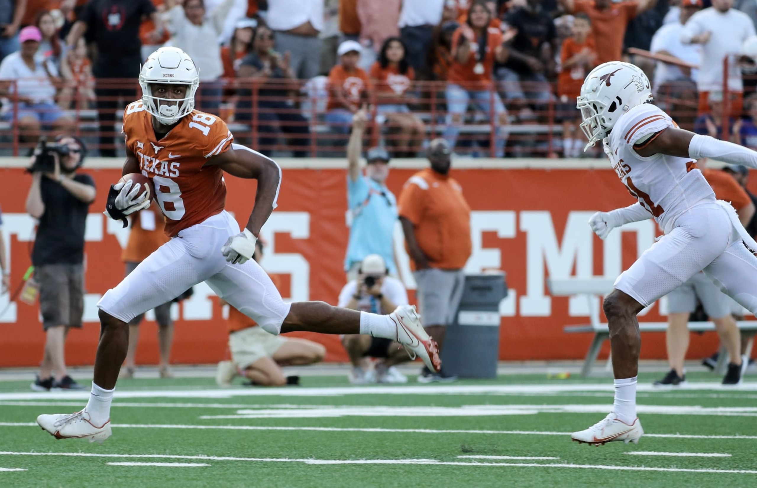 AUSTIN, TEXAS - APRIL 23: Isaiah Neyor #18 of Texas Longhorns catches a pass for a touchdownduring the Orange-White Spring Game at Darrell K Royal-Texas Memorial Stadium on April 23, 2022 in Austin, Texas. (Photo by Tim Warner/Getty Images)