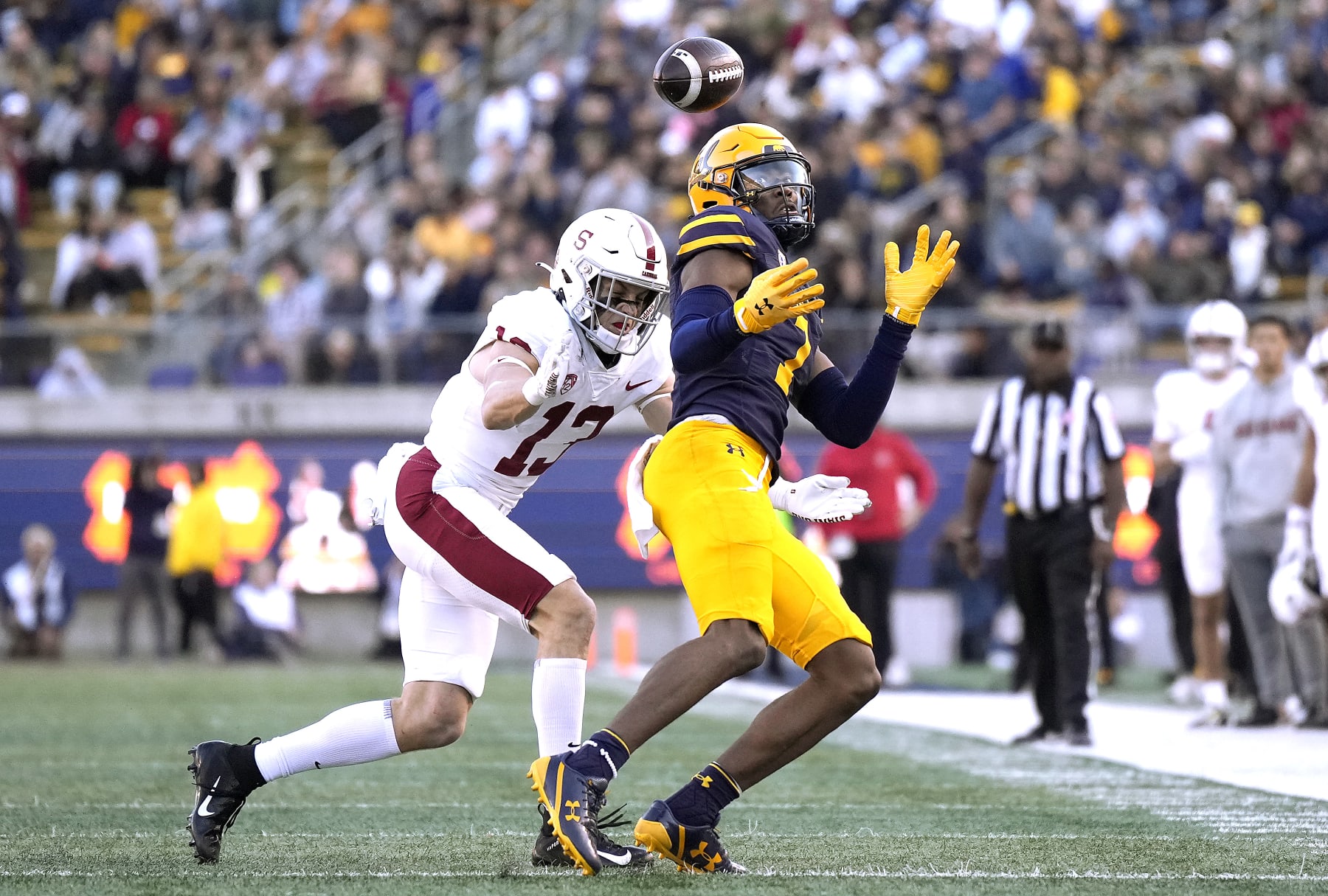 BERKELEY, CALIFORNIA - NOVEMBER 19: J. Michael Sturdivant #7 of the California Golden Bears can't hold on to the pass while getting hit by Ethan Bonner #13 of the Stanford Cardinal during the second quarter at California Memorial Stadium on November 19, 2022 in Berkeley, California. (Photo by Thearon W. Henderson/Getty Images)