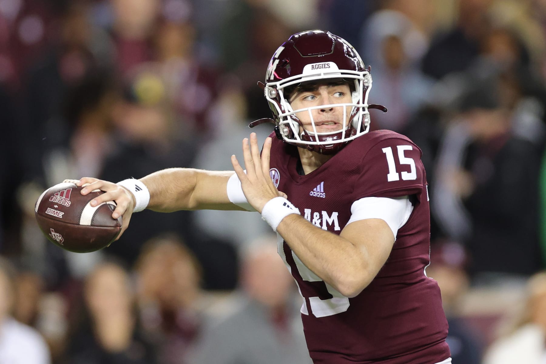 COLLEGE STATION, TEXAS - NOVEMBER 26: Conner Weigman #15 of the Texas A&M Aggies looks to pass against the LSU Tigers during the first half at Kyle Field on November 26, 2022 in College Station, Texas. (Photo by Carmen Mandato/Getty Images)