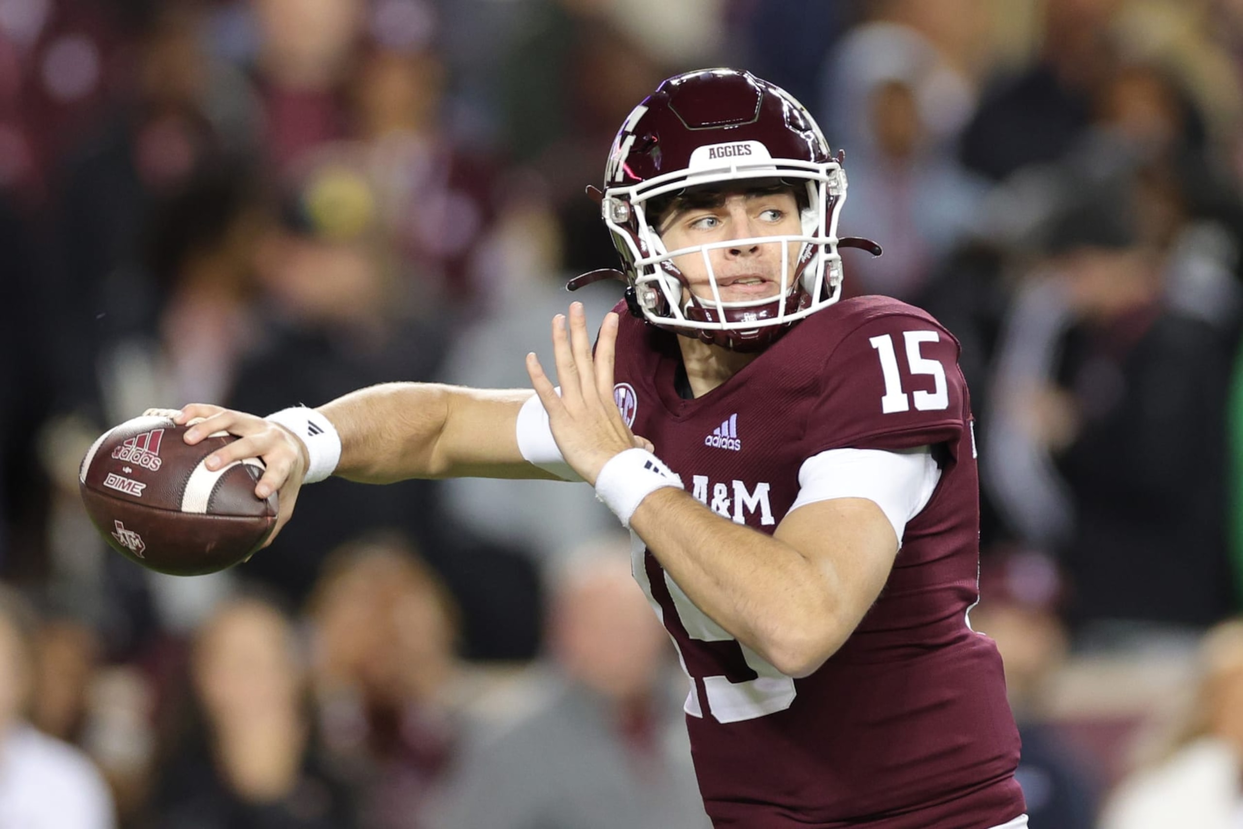 COLLEGE STATION, TEXAS - NOVEMBER 26: Conner Weigman #15 of the Texas A&M Aggies looks to pass against the LSU Tigers during the first half at Kyle Field on November 26, 2022 in College Station, Texas. (Photo by Carmen Mandato/Getty Images)
