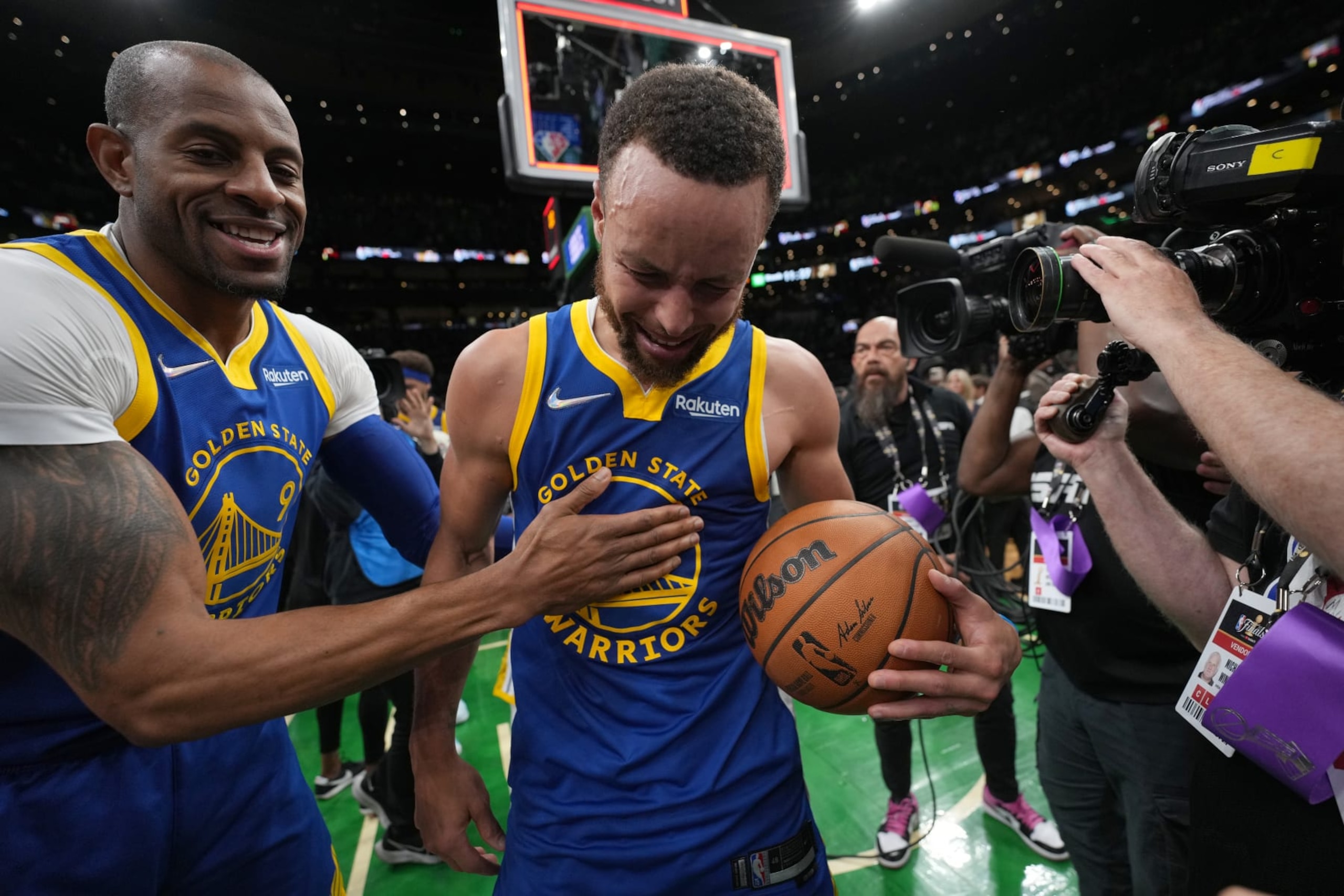 BOSTON, MA - JUNE 16: Andre Iguodala #9 of the Golden State Warriors embraces Stephen Curry #30 of the Golden State Warriors after Game Six of the 2022 NBA Finals on June 16, 2022 at TD Garden in Boston, Massachusetts. NOTE TO USER: User expressly acknowledges and agrees that, by downloading and or using this photograph, user is consenting to the terms and conditions of Getty Images License Agreement. Mandatory Copyright Notice: Copyright 2022 NBAE (Photo by Jesse D. Garrabrant/NBAE via Getty Images)