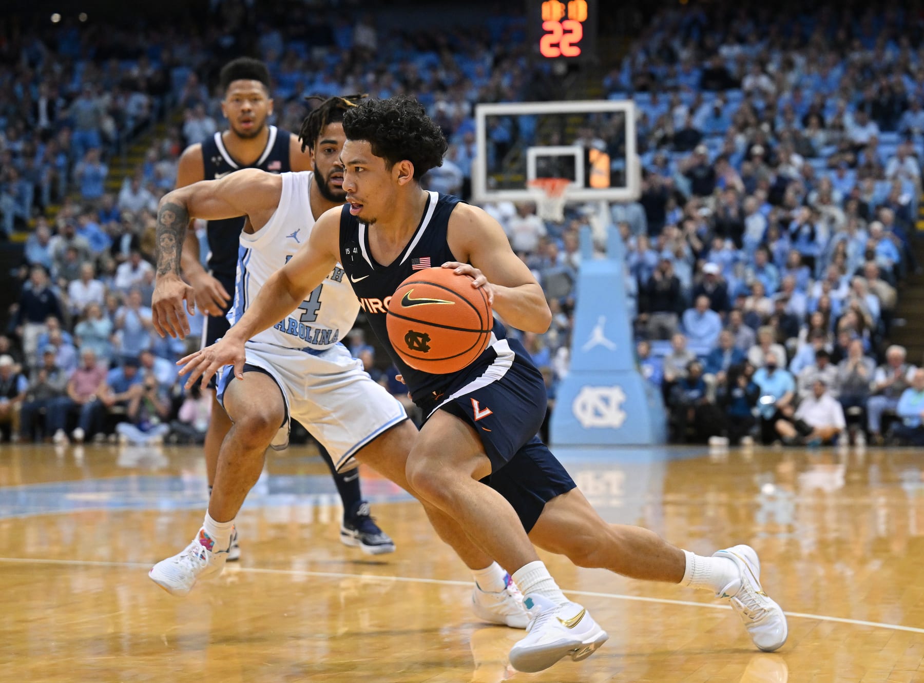CHAPEL HILL, NORTH CAROLINA - FEBRUARY 25: Kihei Clark #0 of the Virginia Cavaliers drives against R.J. Davis #4 of the North Carolina Tar Heels during their game at the Dean E. Smith Center on February 25, 2023 in Chapel Hill, North Carolina.  (Photo by Grant Halverson/Getty Images)