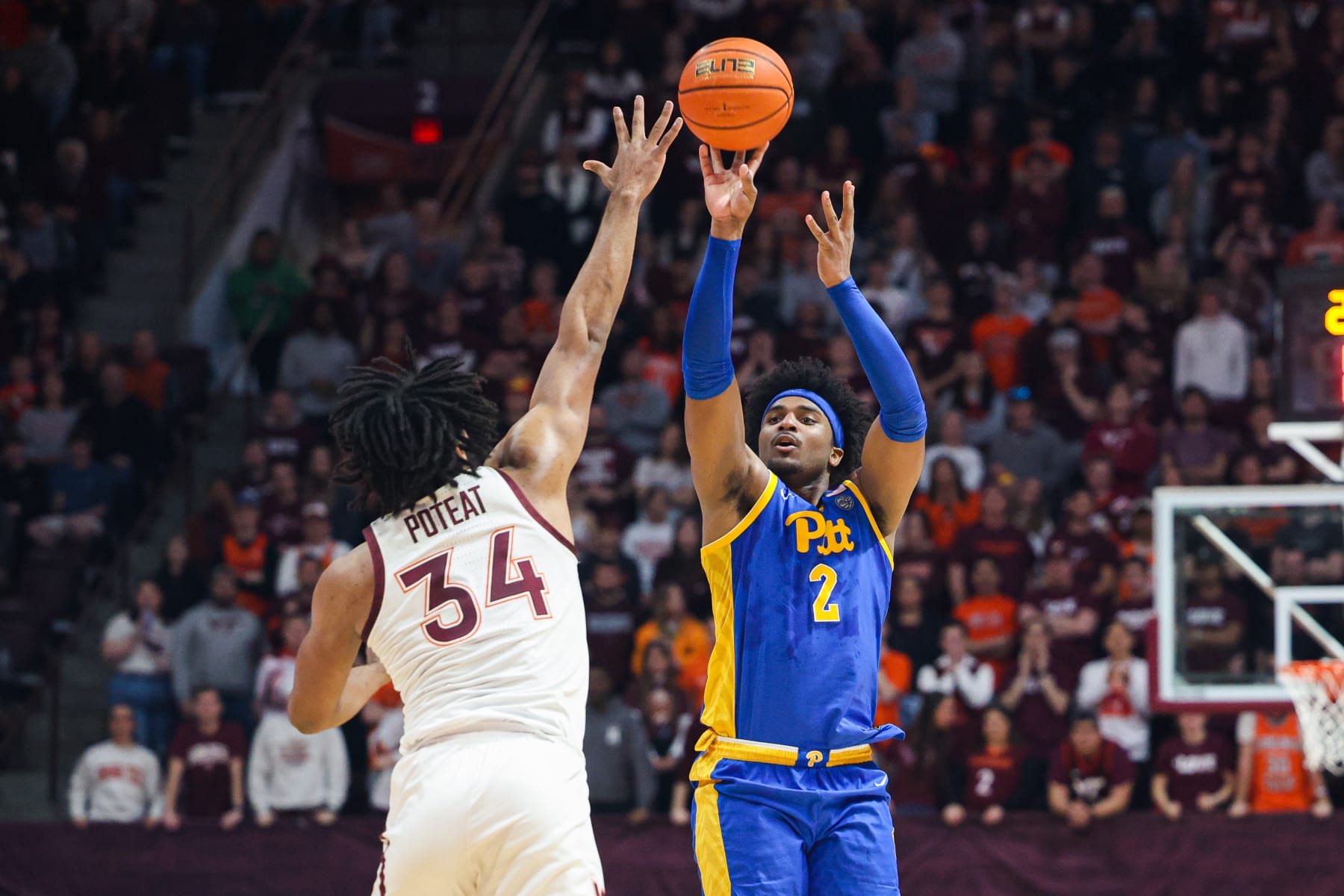BLACKSBURG, VA - FEBRUARY 18: Blake Hinson #2 of the Pittsburgh Panthers shoots over Mylyjael Poteat #34 of the Virginia Tech Hokies in the first half during a game at Cassell Coliseum on February 18, 2023 in Blacksburg, Virginia. (Photo by Ryan Hunt/Getty Images)