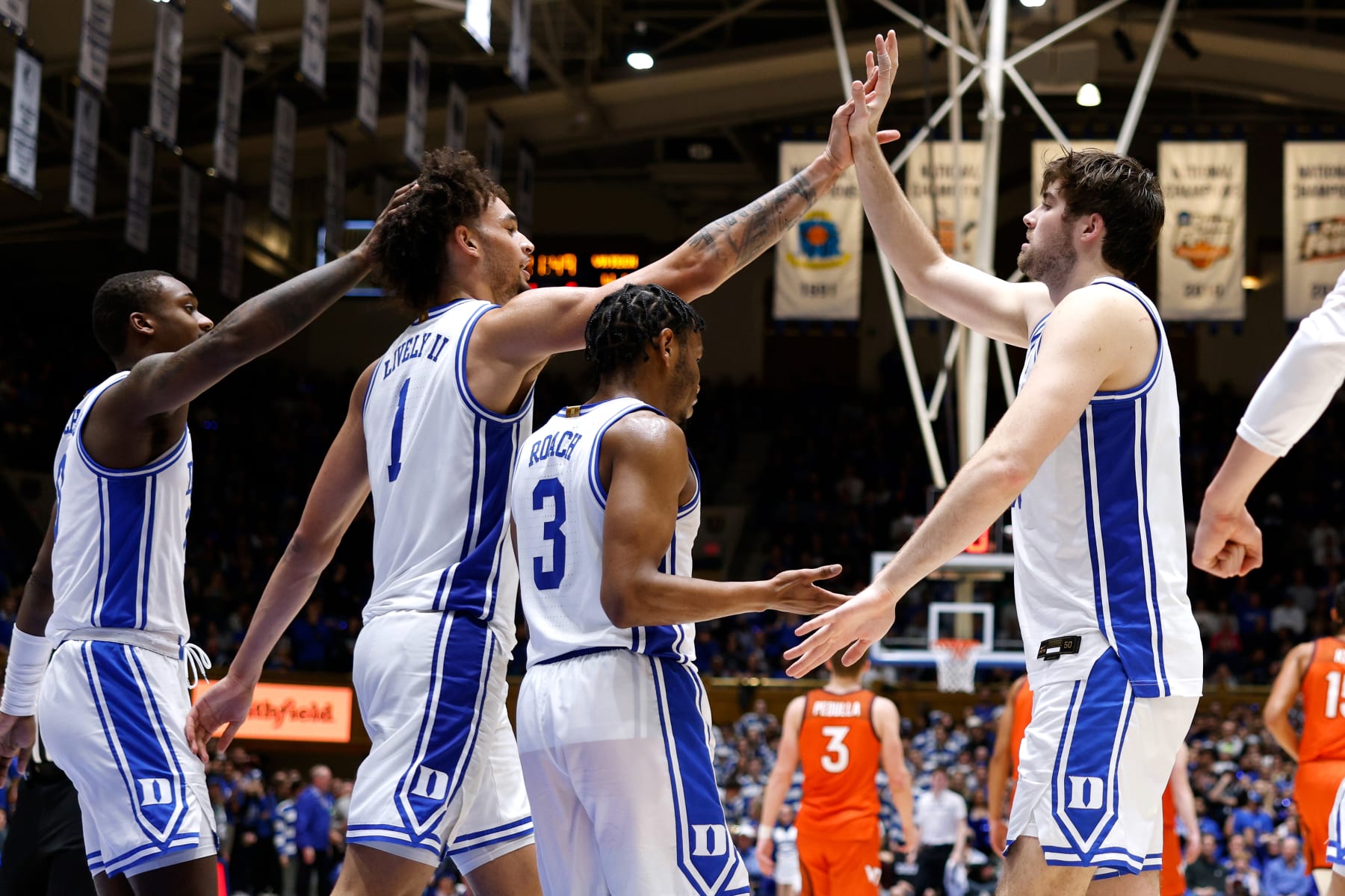 DURHAM, NC - FEBRUARY 25: Dereck Lively II #1 of the Duke Blue Devils high-fives Ryan Young #15 during the second half of their game against the Virginia Tech Hokies at Cameron Indoor Stadium on February 25, 2023 in Durham, North Carolina. Duke won 81-65. (Photo by Lance King/Getty Images)