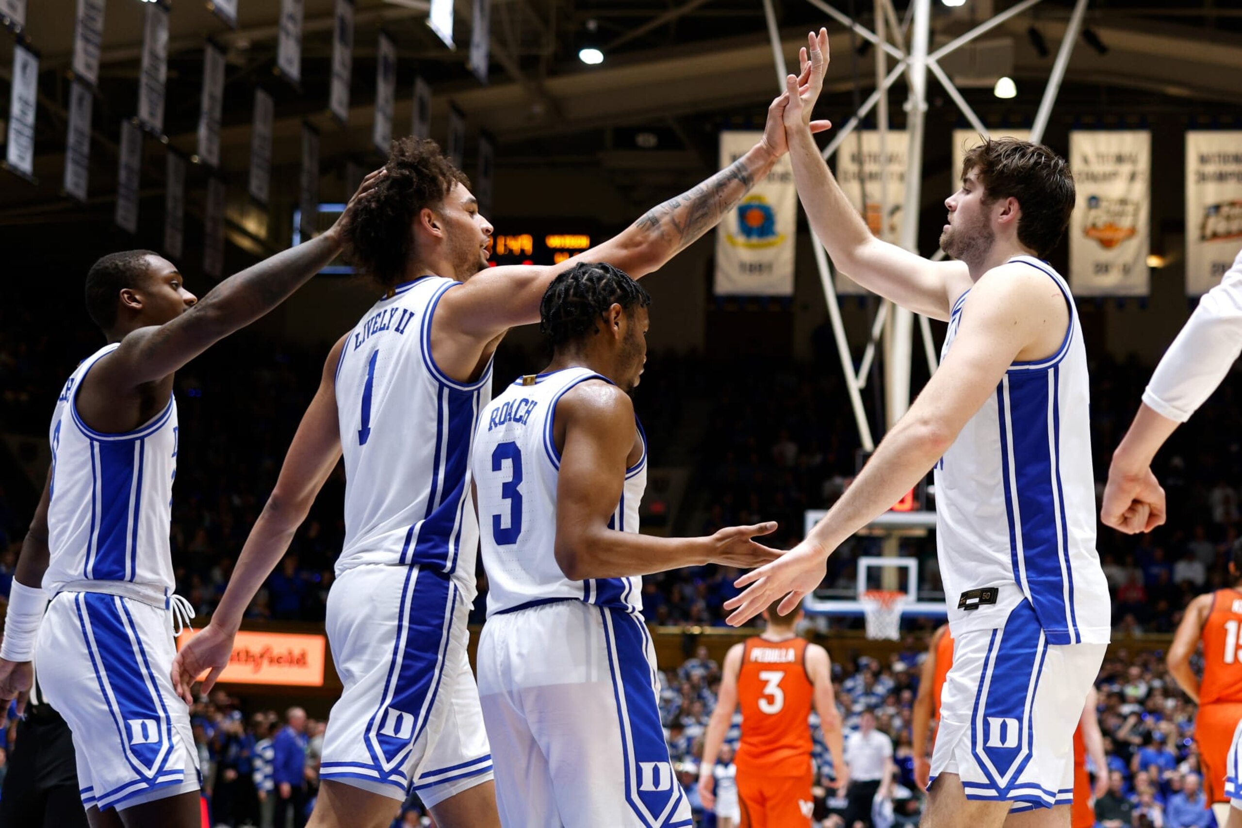 DURHAM, NC - FEBRUARY 25: Dereck Lively II #1 of the Duke Blue Devils high-fives Ryan Young #15 during the second half of their game against the Virginia Tech Hokies at Cameron Indoor Stadium on February 25, 2023 in Durham, North Carolina. Duke won 81-65. (Photo by Lance King/Getty Images)