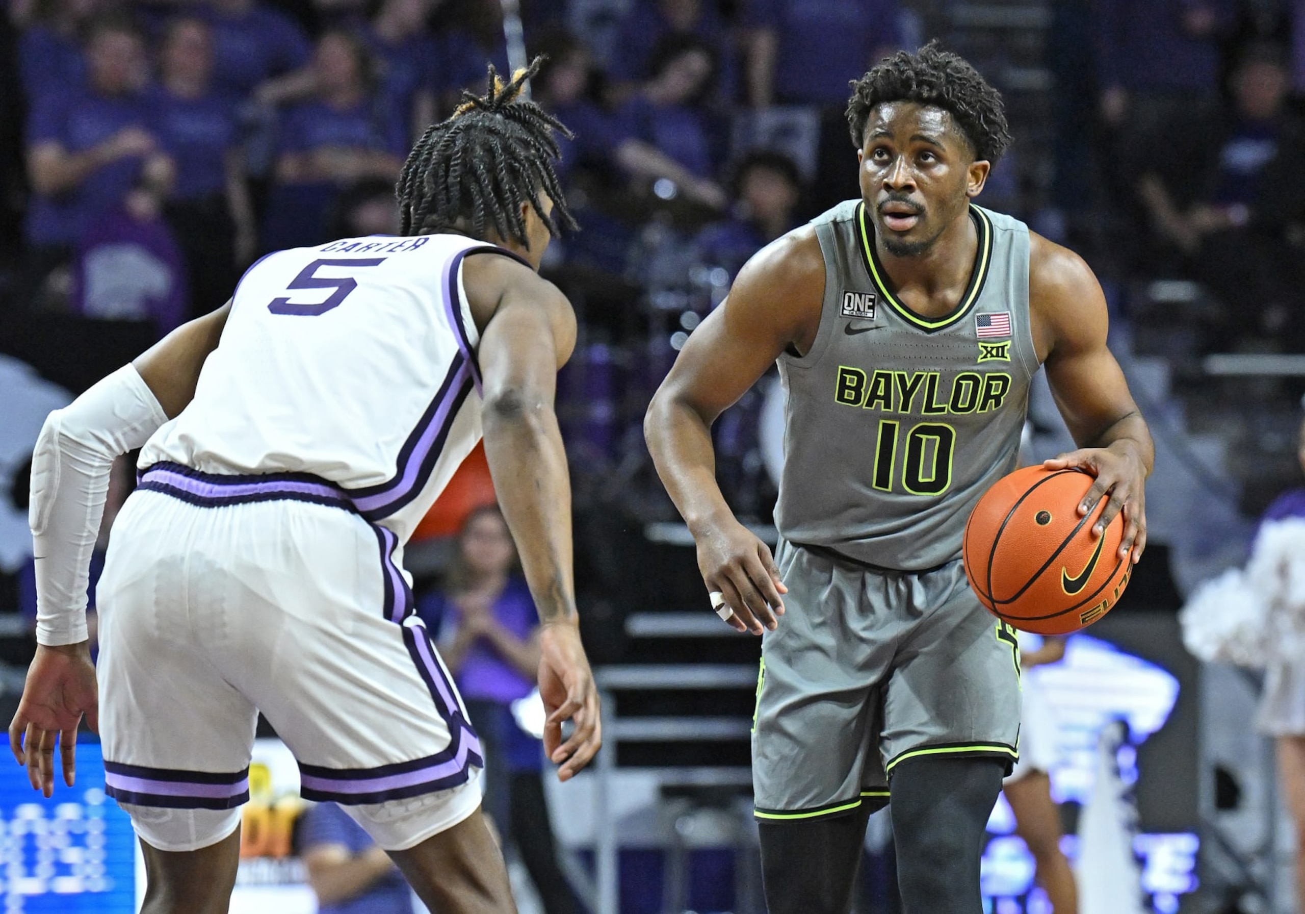 MANHATTAN, KS - FEBRUARY 21: Adam Flagler #10 of the Baylor Bears dribbles the ball up court during a game in the first half against Cam Carter #5 of the Kansas State Wildcats at Bramlage Coliseum on February 21, 2023 in Manhattan, Kansas.  (Photo by Peter G. Aiken/Getty Images)