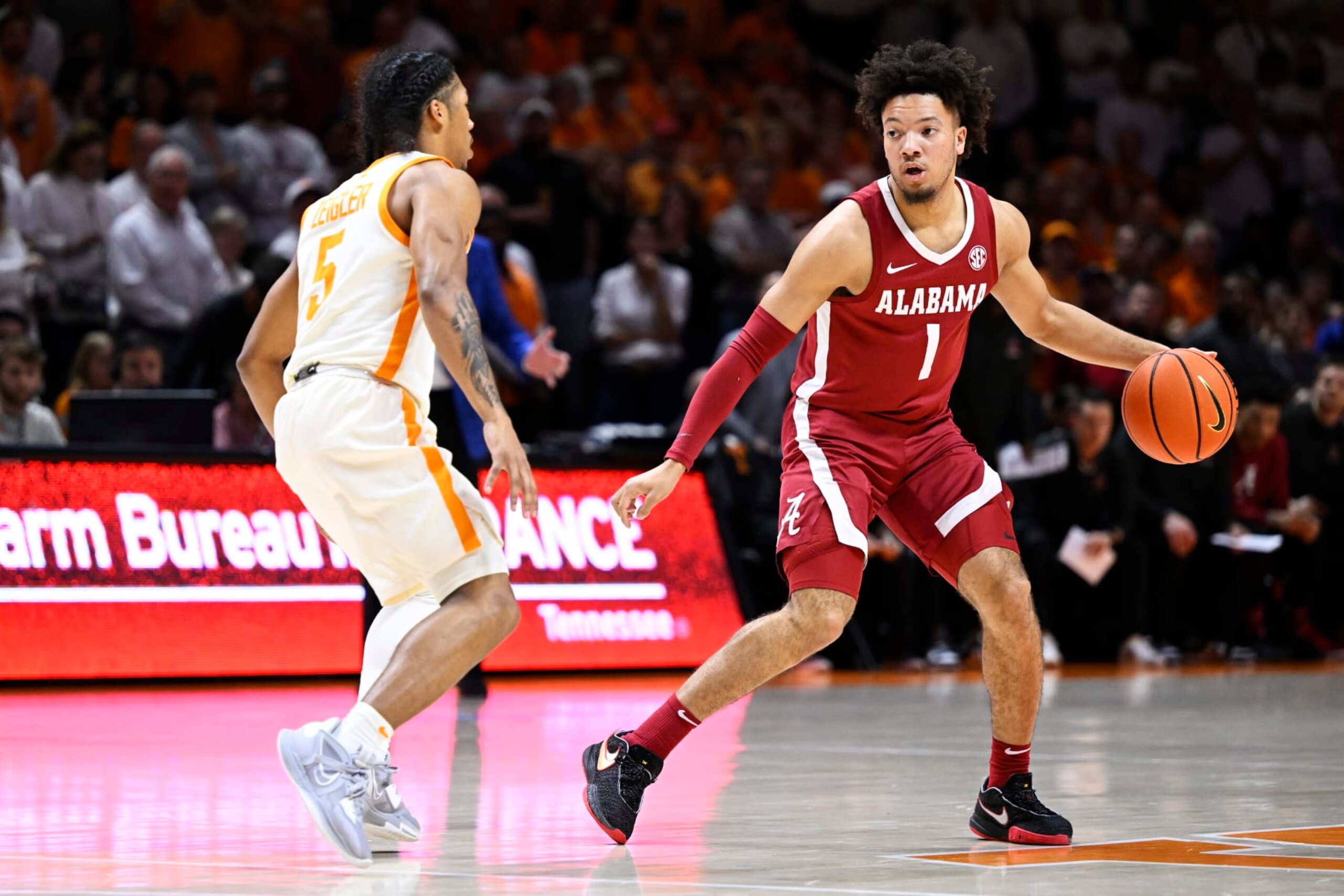 KNOXVILLE, TENNESSEE - FEBRUARY 15: Mark Sears #1 of the Alabama Crimson Tide dribbles against Zakai Zeigler #5 of the Tennessee Volunteers in the first half at Thompson-Boling Arena on February 15, 2023 in Knoxville, Tennessee. (Photo by Eakin Howard/Getty Images)