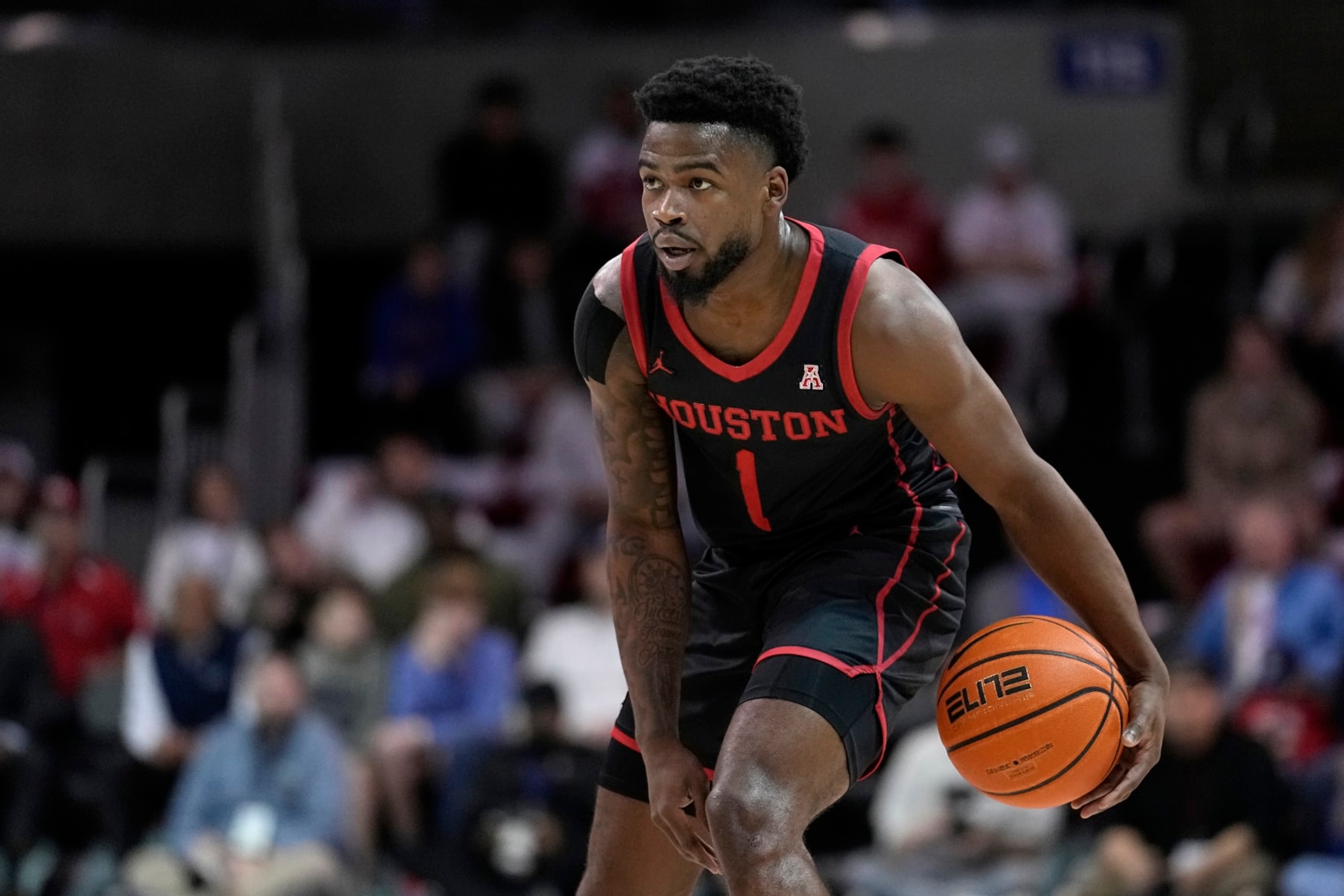 Houston guard Jamal Shead advances the ball against SMU during an NCAA college basketball game, Thursday, Feb. 16, 2023, in Dallas. (AP Photo/Tony Gutierrez)