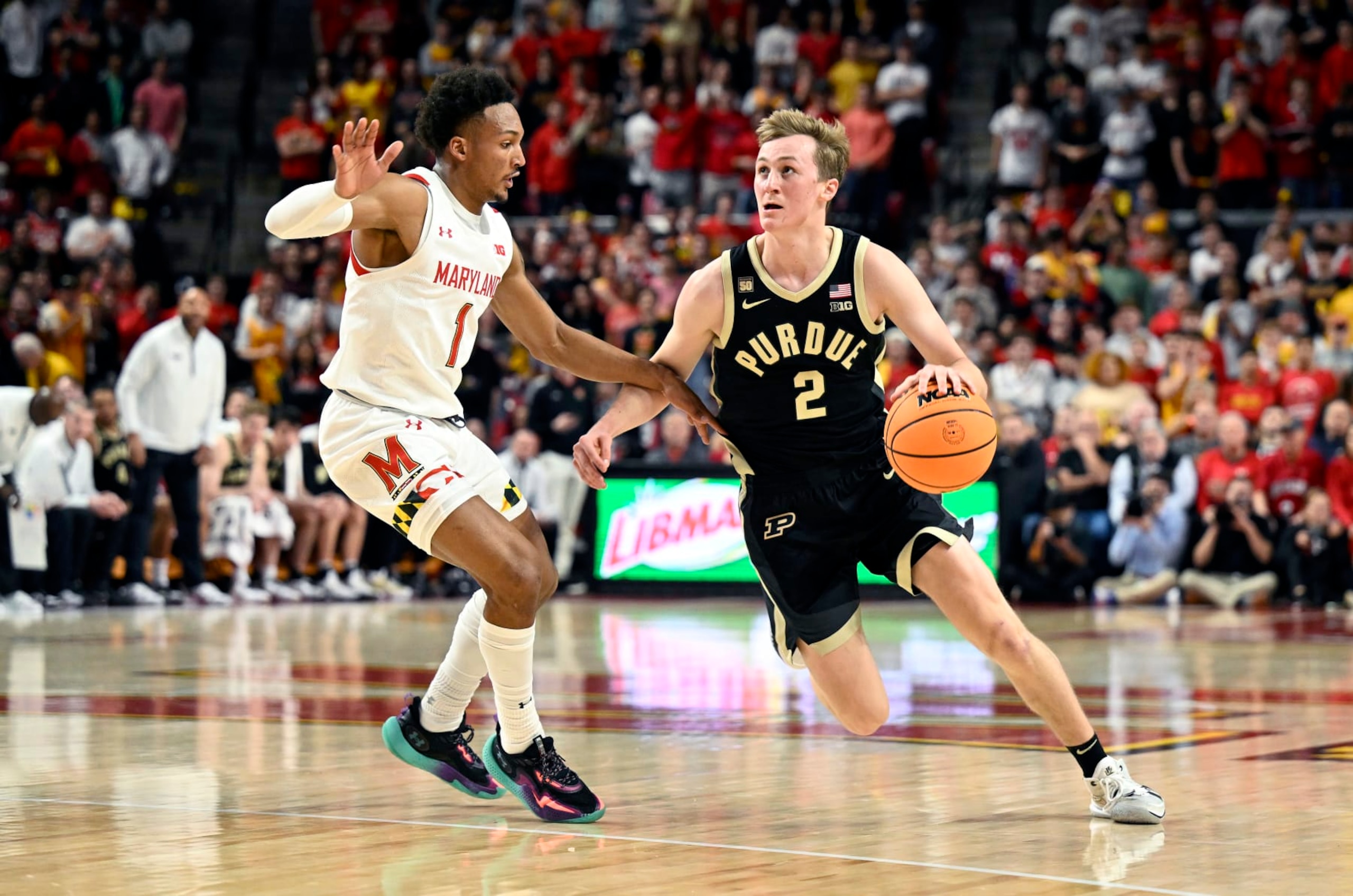 COLLEGE PARK, MARYLAND - FEBRUARY 16: Fletcher Loyer #2 of the Purdue Boilermakers handles the ball against Jahmir Young #1 of the Maryland Terrapins at Xfinity Center on February 16, 2023 in College Park, Maryland. (Photo by G Fiume/Getty Images)