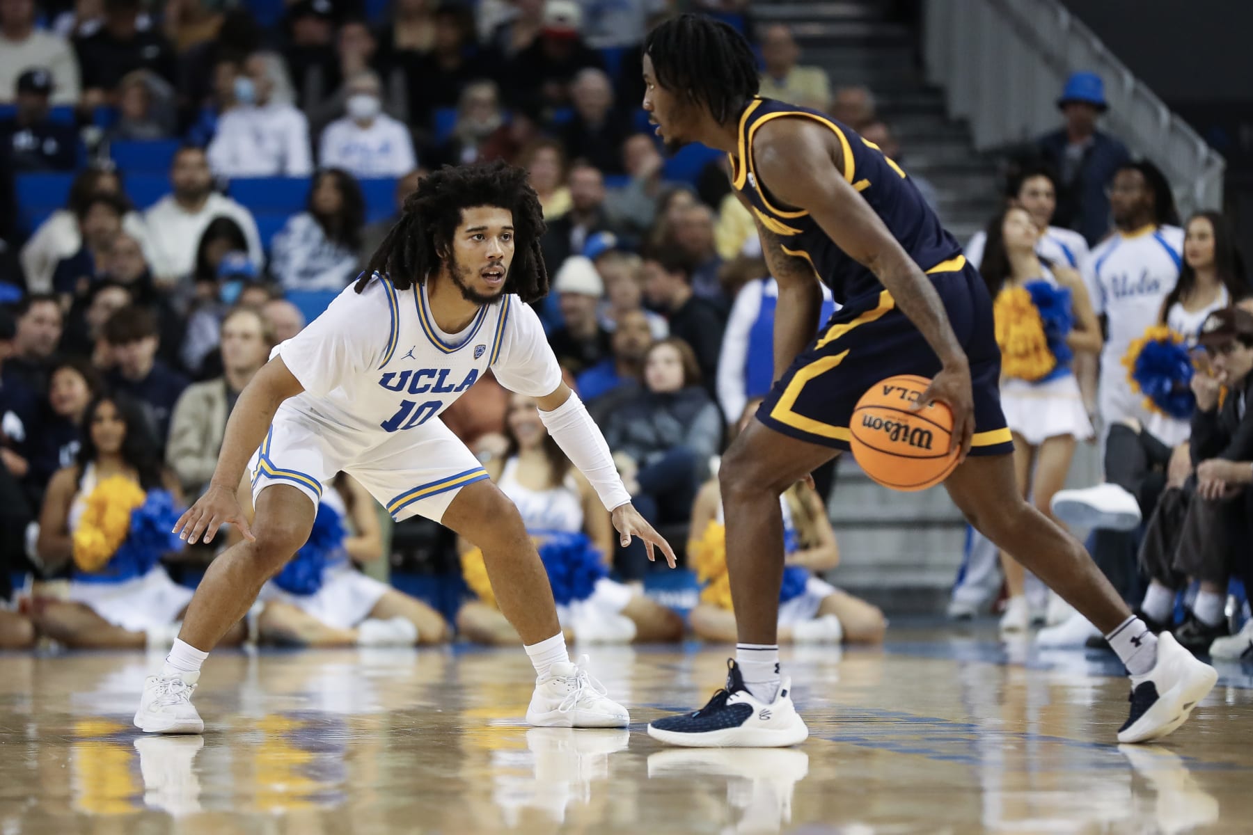 LOS ANGELES, CALIFORNIA - FEBRUARY 18: Tyger Campbell #10 of the UCLA Bruins defends Joel Brown #1 of the California Golden Bears in the first half at UCLA Pauley Pavilion on February 18, 2023 in Los Angeles, California. (Photo by Meg Oliphant/Getty Images)