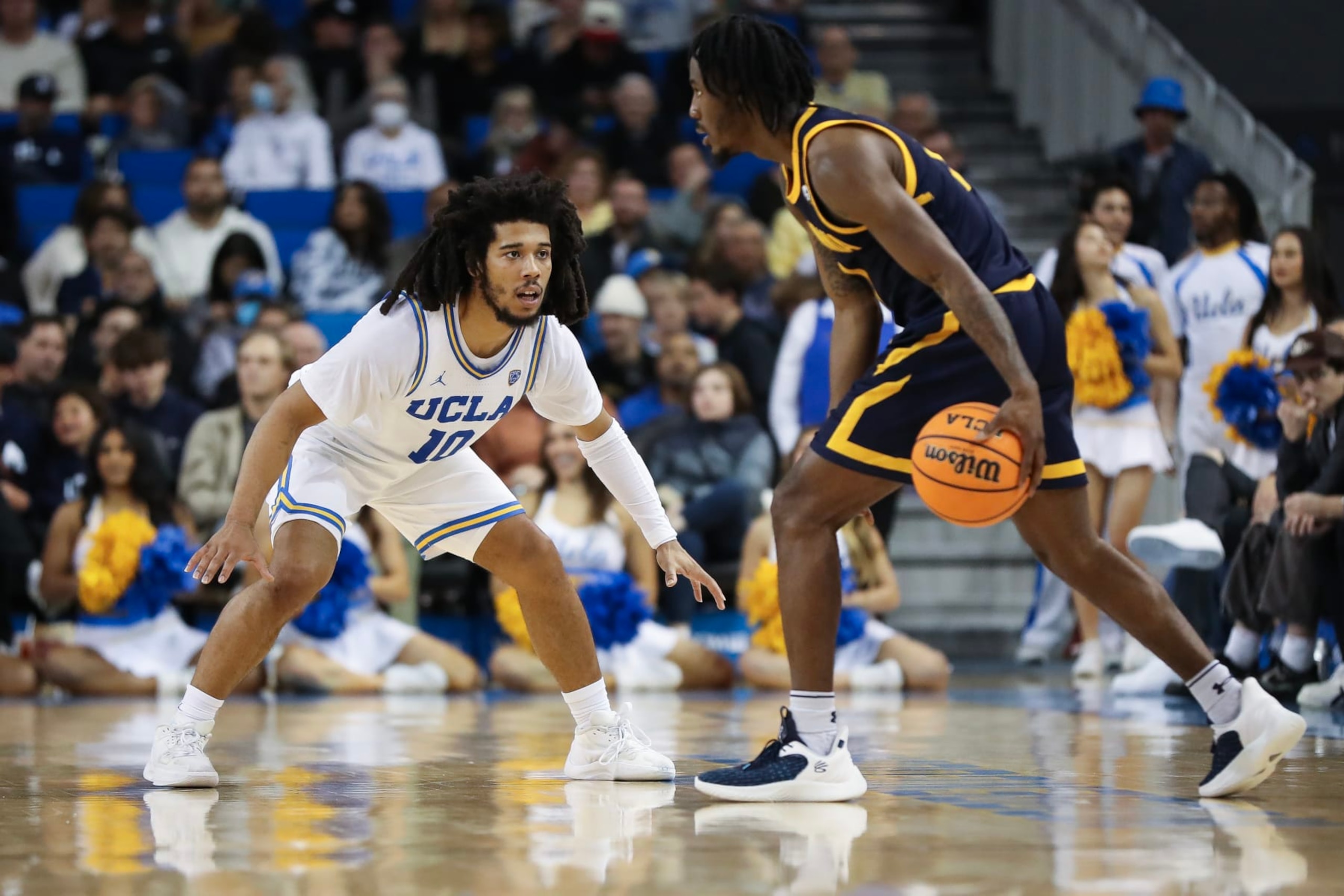 LOS ANGELES, CALIFORNIA - FEBRUARY 18: Tyger Campbell #10 of the UCLA Bruins defends Joel Brown #1 of the California Golden Bears in the first half at UCLA Pauley Pavilion on February 18, 2023 in Los Angeles, California. (Photo by Meg Oliphant/Getty Images)