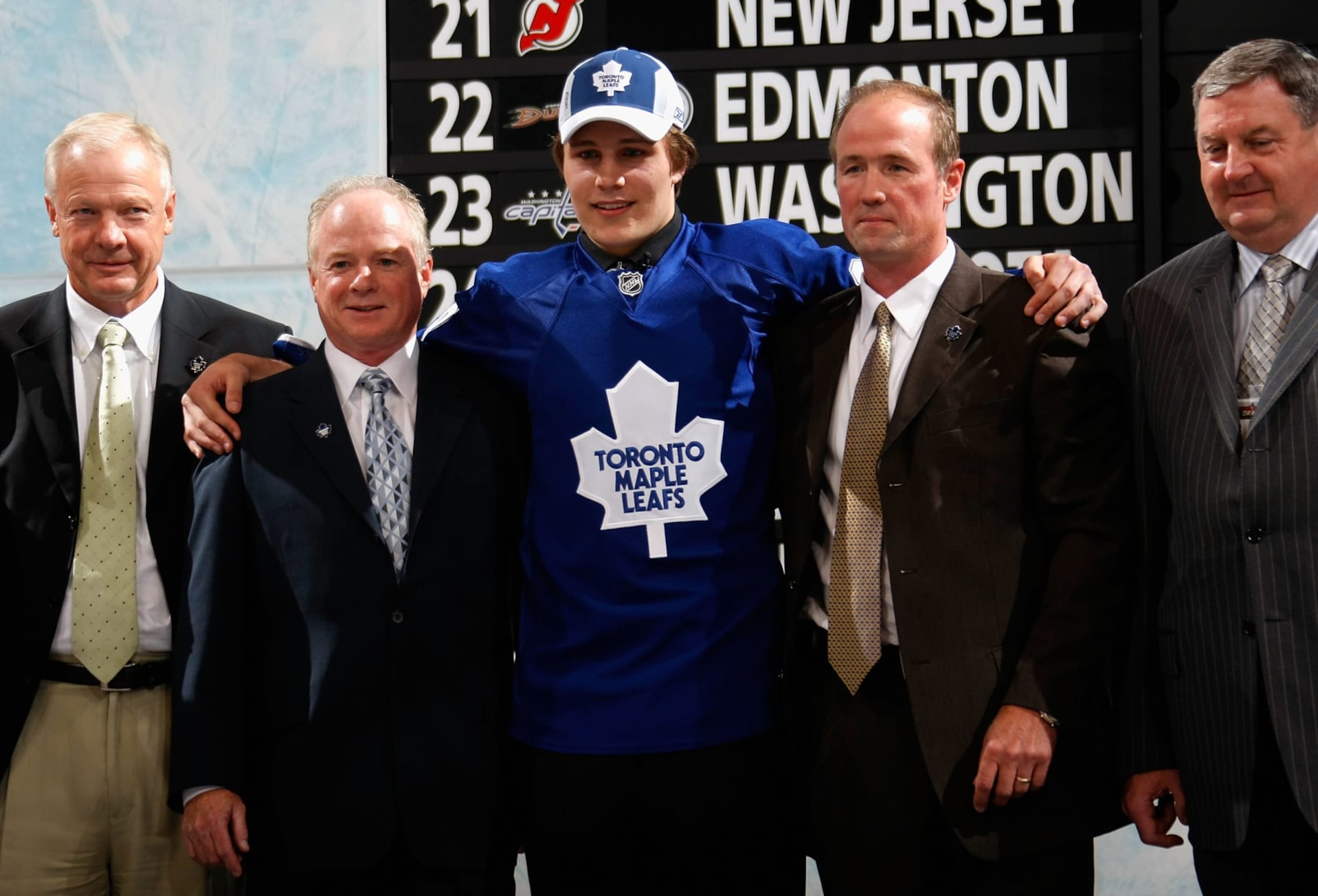 OTTAWA, ON - JUNE 20:  Fifth overall pick, Luke Schenn of the Toronto Maple Leafs poses with team personnel after being selected in the 2008 NHL Entry Draft at Scotiabank Place on June 20, 2008 in Ottawa, Ontario, Canada.  (Photo by Dave Sandford/NHLI via Getty Images)