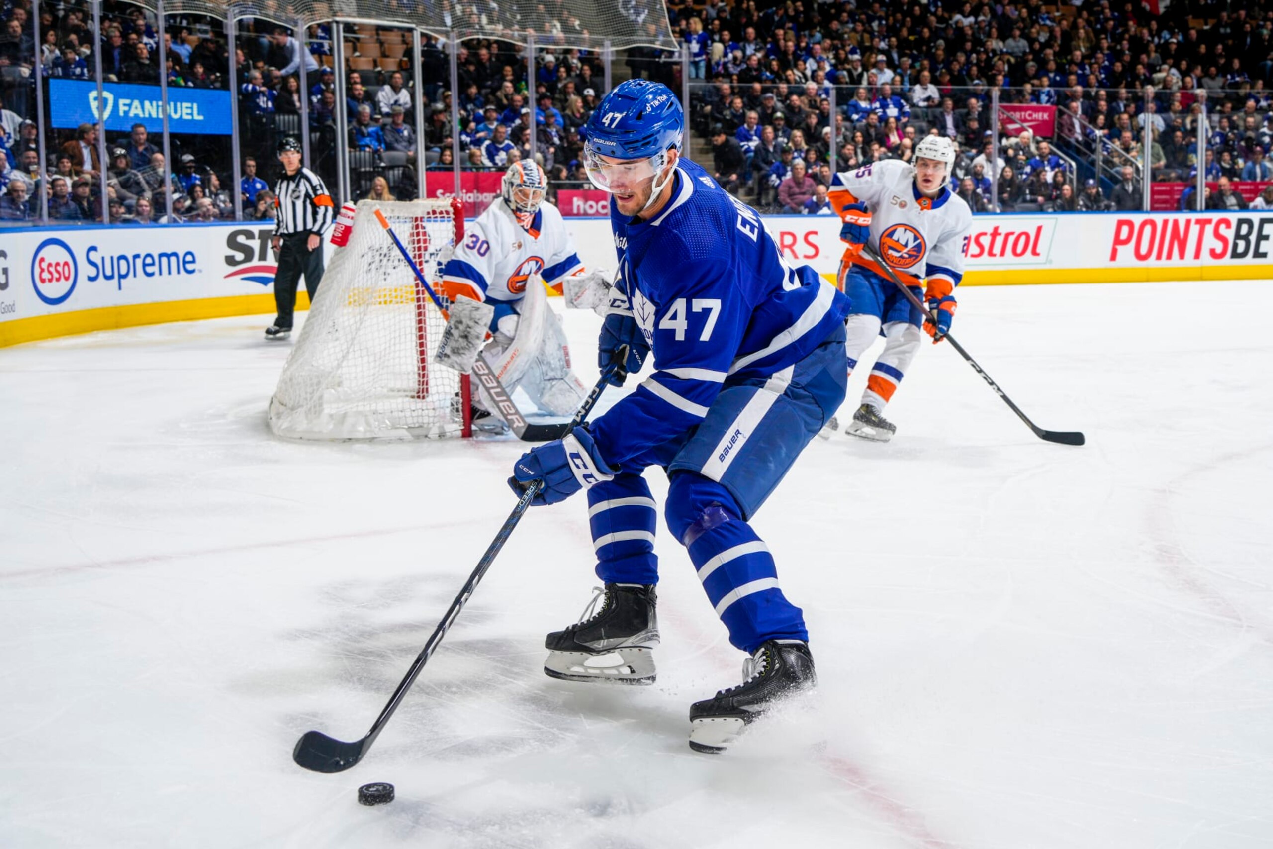 TORONTO, ON - NOVEMBER 21: Pierre Engvall #47 of the Toronto Maple Leafs plays the puck against the New York Islanders during the first period at the Scotiabank Arena on November 21, 2022 in Toronto, Ontario, Canada. (Photo by Mark Blinch/NHLI via Getty Images)