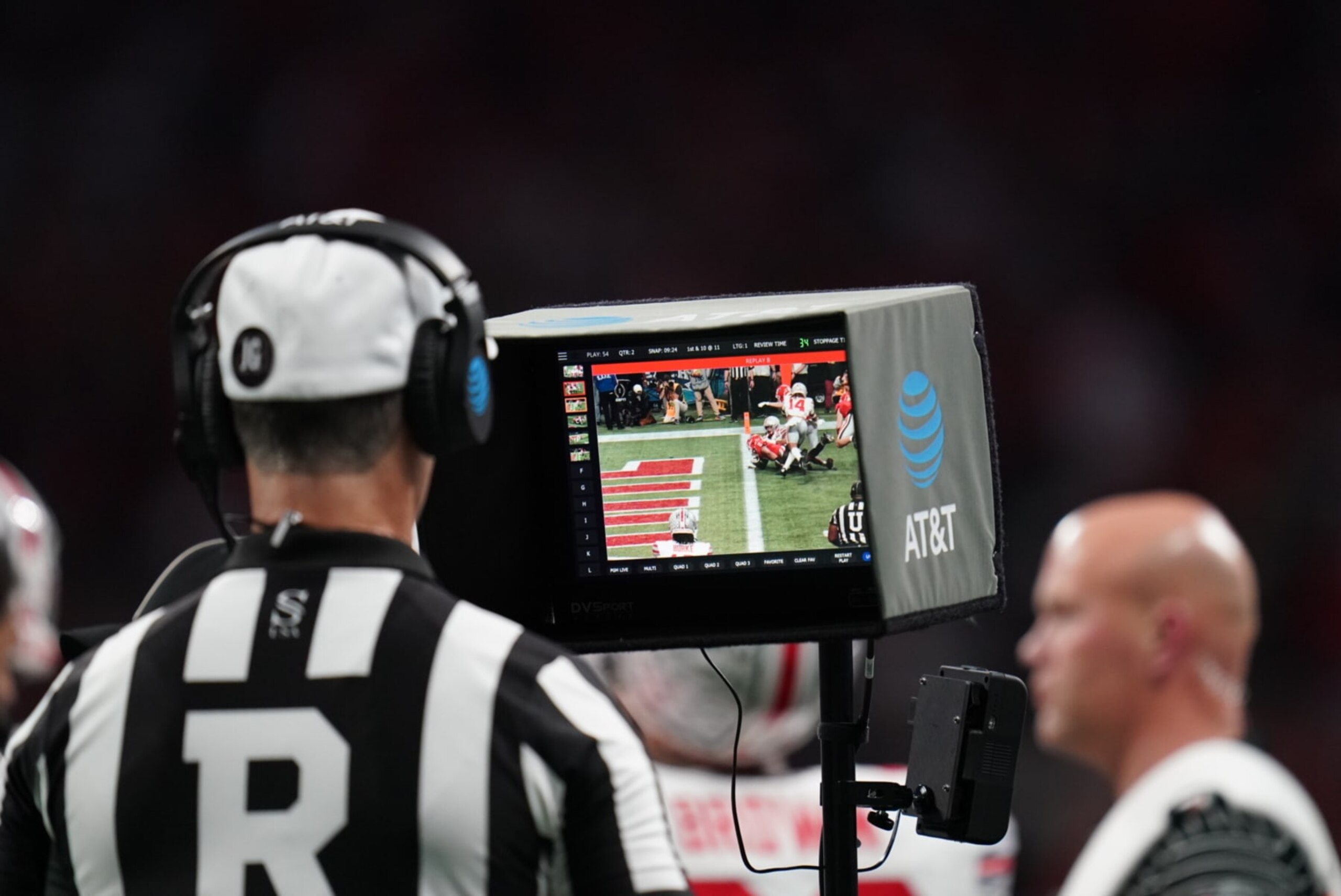 College Football: Peach Bowl: Referee performs a booth review on Georgia Kenny McIntosh (6) touchdown run vs Ohio State at Mercedes-Benz Stadium. 
Atlanta, GA 12/31/2022 
CREDIT: Carlos M. Saavedra (Photo by Carlos M. Saavedra/Sports Illustrated via Getty Images) 
(Set Number: X164268 TK1)