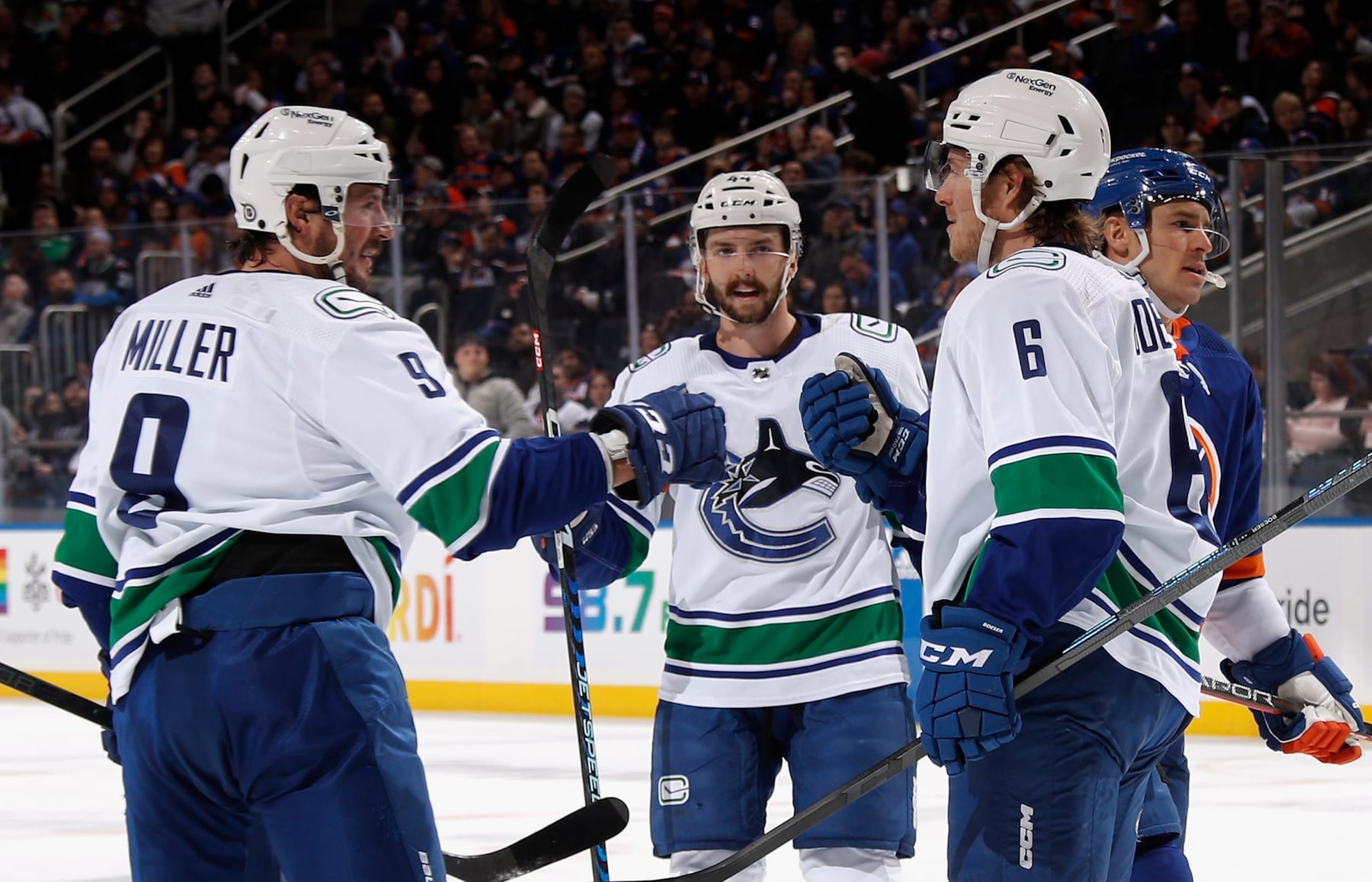 ELMONT, NEW YORK - FEBRUARY 09: Brock Boeser #6 of the Vancouver Canucks (R) celebrates his first period goal against the New York Islanders and is joined by Conor Garland #8 (L) and Kyle Burroughs #44 (C) at UBS Arena on February 09, 2023 in Elmont, New York. (Photo by Bruce Bennett/Getty Images) ELMONT, NEW YORK - FEBRUARY 09: Brock Boeser #6 of the Vancouver Canucks (R) celebrates his first period goal against the New York Islanders and is joined by Conor Garland #8 (L) and Kyle Burroughs #44 (C) at UBS Arena on February 09, 2023 in Elmont, New York. (Photo by Bruce Bennett/Getty Images)