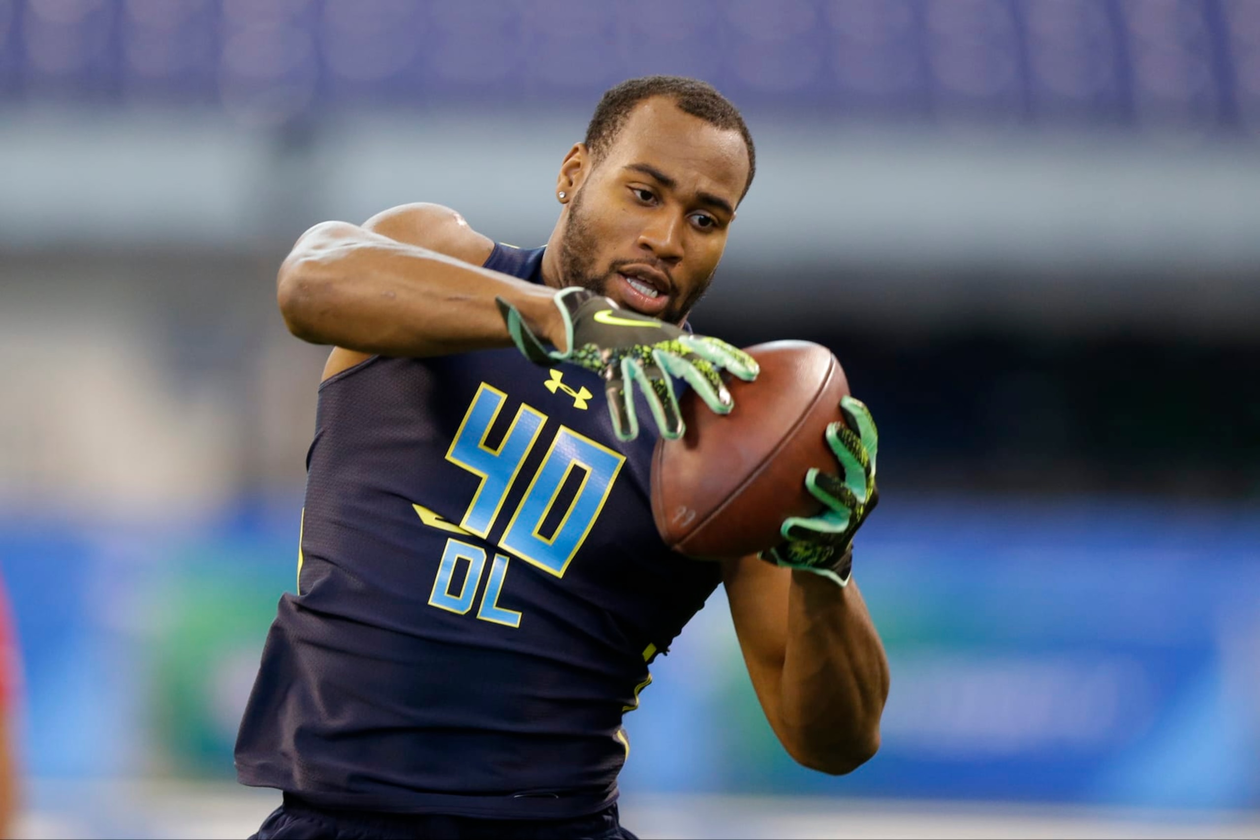 Temple defensive end Haason Reddick runs a drill at the NFL football scouting combine in Indianapolis, Sunday, March 5, 2017. (AP Photo/Michael Conroy)