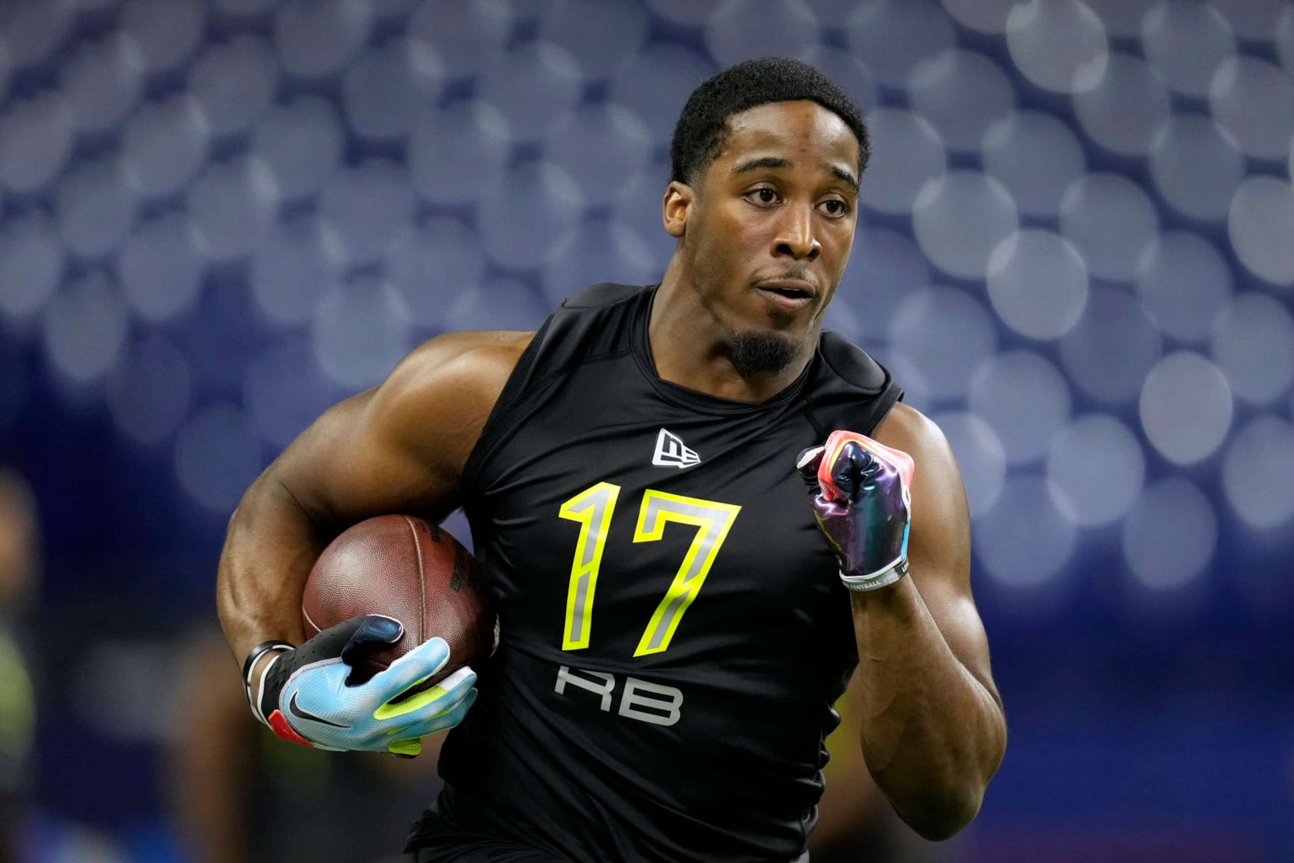 Iowa State running back Breece Hall participates in a drill at the NFL football scouting combine in Indianapolis, Friday, March 4, 2022. (AP Photo/Charlie Neibergall)