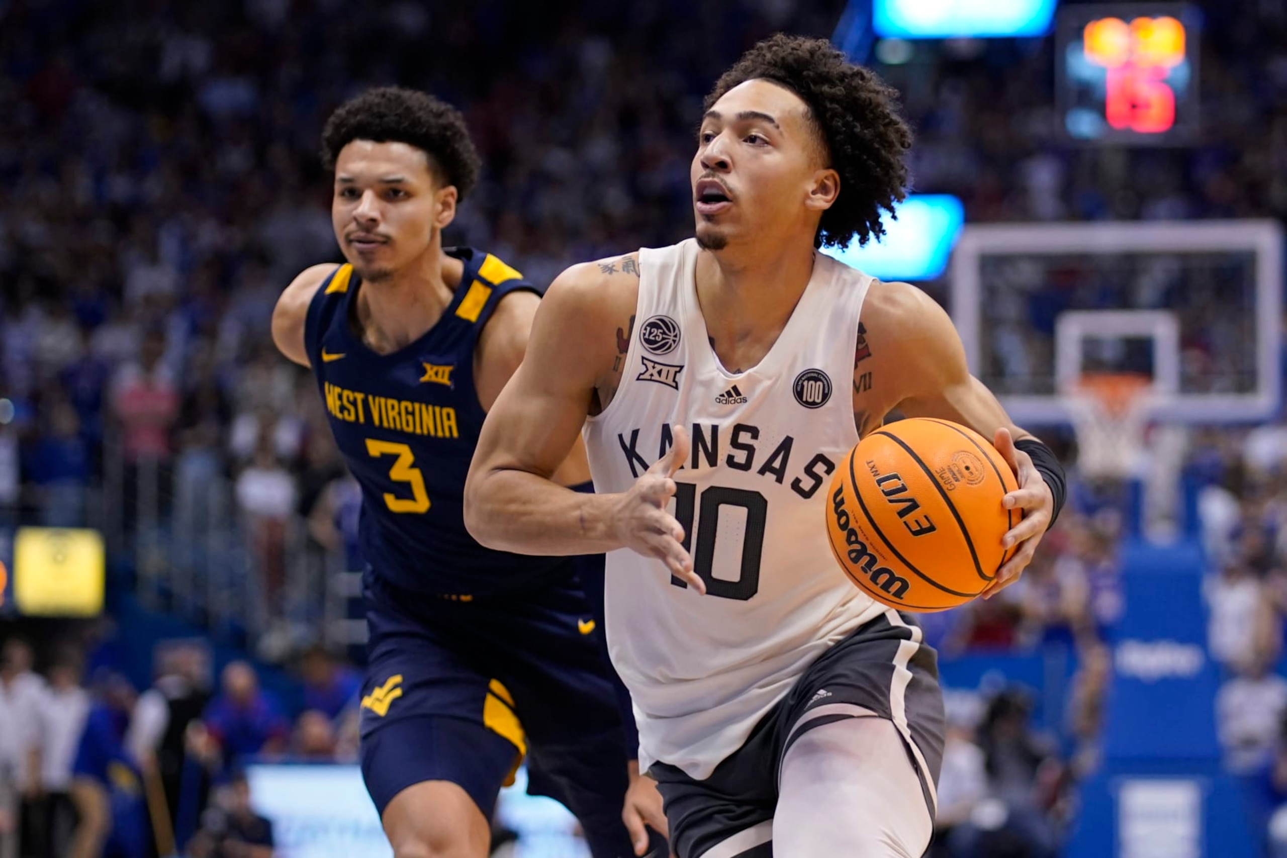 Jalen Wilson of Kansas drives to the basket against West Virginia