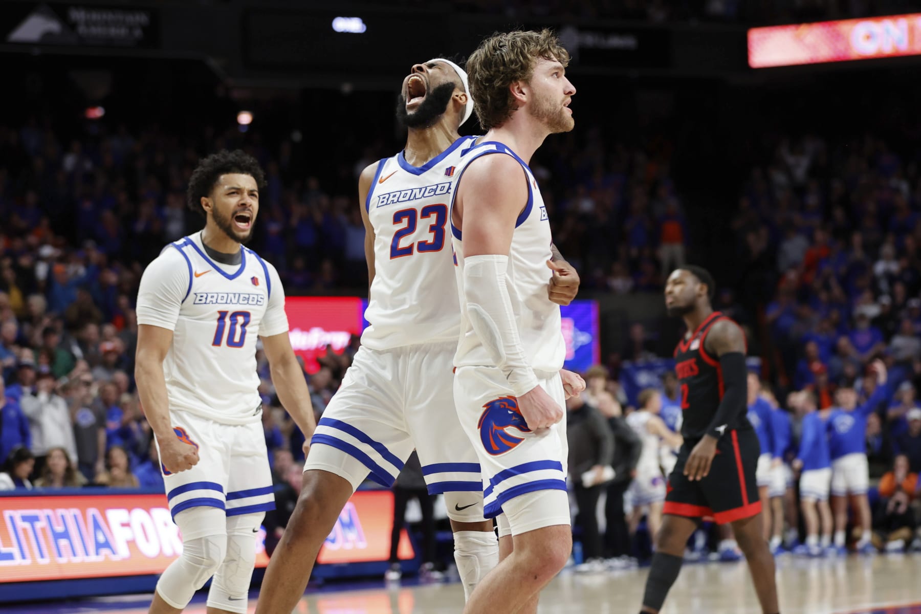 Boise State's Naje Smith (23), Max Rice, and Marcus Shaver Jr. (10) react near the end of an NCAA college basketball game against San Diego State in Boise, Idaho, Tuesday, Feb. 28, 2023. (AP Photo/Otto Kitsinger)