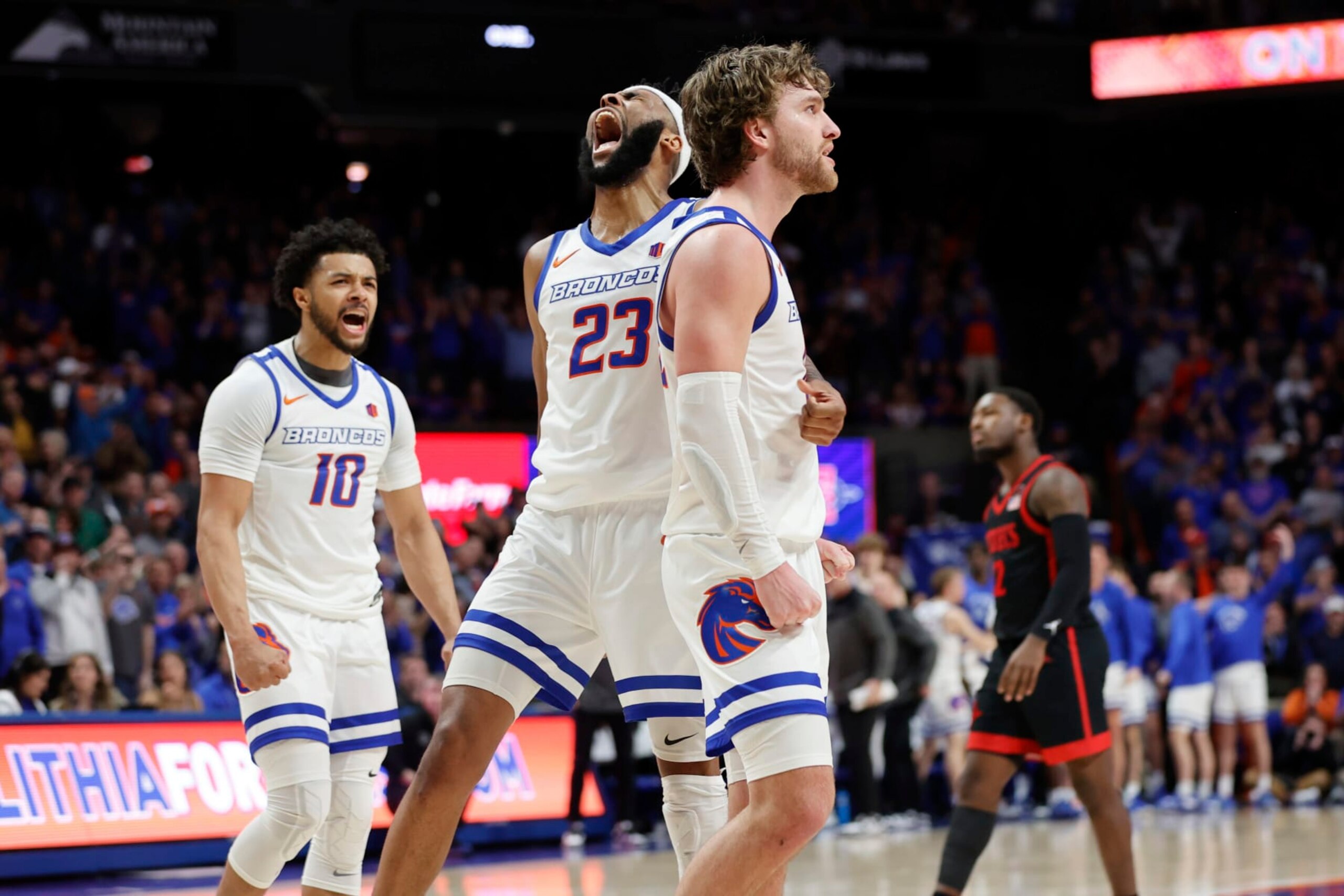 Boise State's Naje Smith (23), Max Rice, and Marcus Shaver Jr. (10) react near the end of an NCAA college basketball game against San Diego State in Boise, Idaho, Tuesday, Feb. 28, 2023. (AP Photo/Otto Kitsinger)