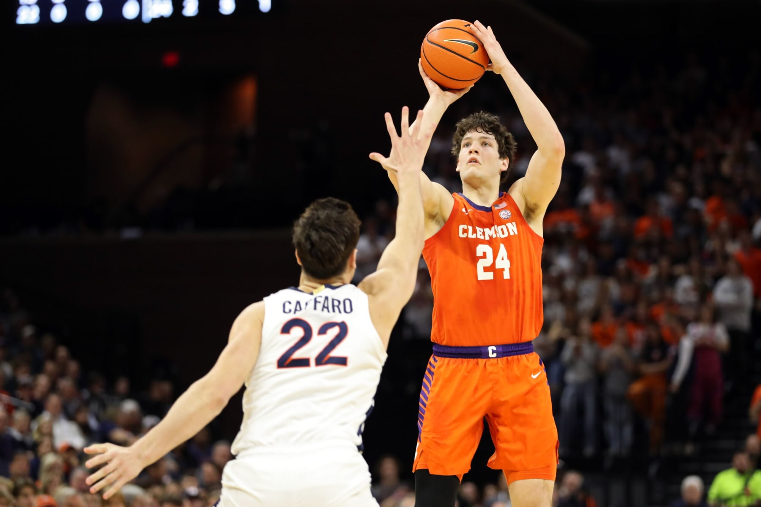 CHARLOTTESVILLE, VA - FEBRUARY 28: PJ Hall #24 of the Clemson Tigers shoots over Francisco Caffaro #22 of the Virginia Cavaliers in the first half during a game at John Paul Jones Arena on February 28, 2023 in Charlottesville, Virginia. (Photo by Ryan M. Kelly/Getty Images)