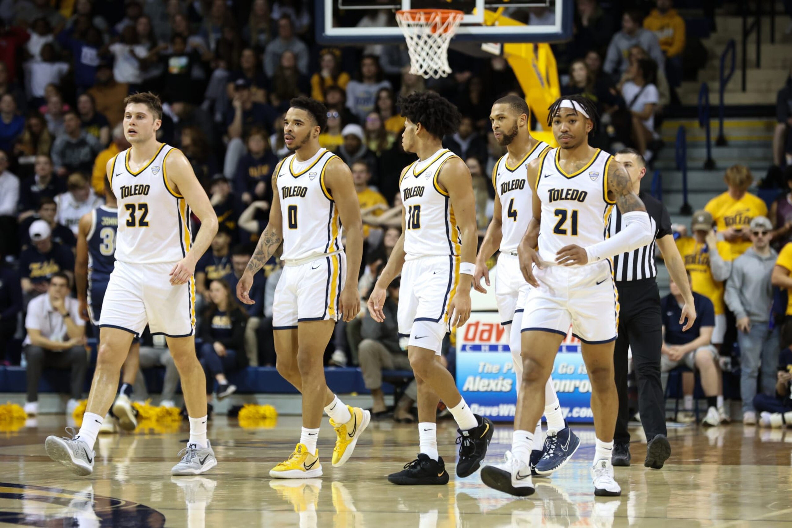 TOLEDO, OH - FEBRUARY 21:  From the left, Toledo Rockets forward JT Shumate (32), guard Ra'Heim Moss (0), guard RayJ Dennis (10), forward Setric Millner Jr. (4), and guard Dante Maddox Jr. (21) walk onto the court after a timeout during the second half of a Mid-American Conference regular season college basketball game between the Akron Zips and the Toledo Rockets on February 21, 2023 at Savage Arena in Toledo, Ohio.  Photo by Scott W. Grau/Icon Sportswire via Getty Images)