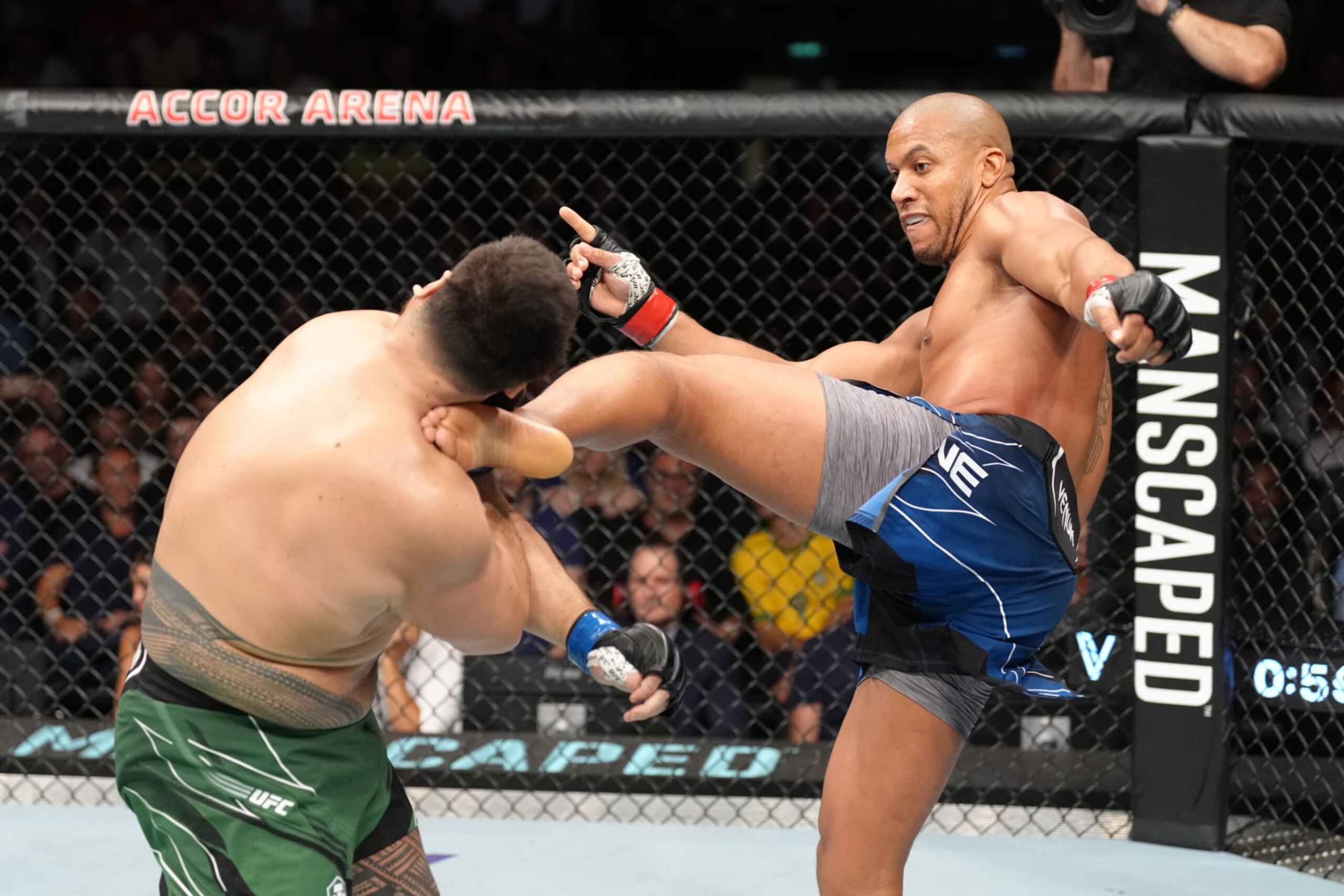 Ciryl Gane kicks Tai Tuivasa.