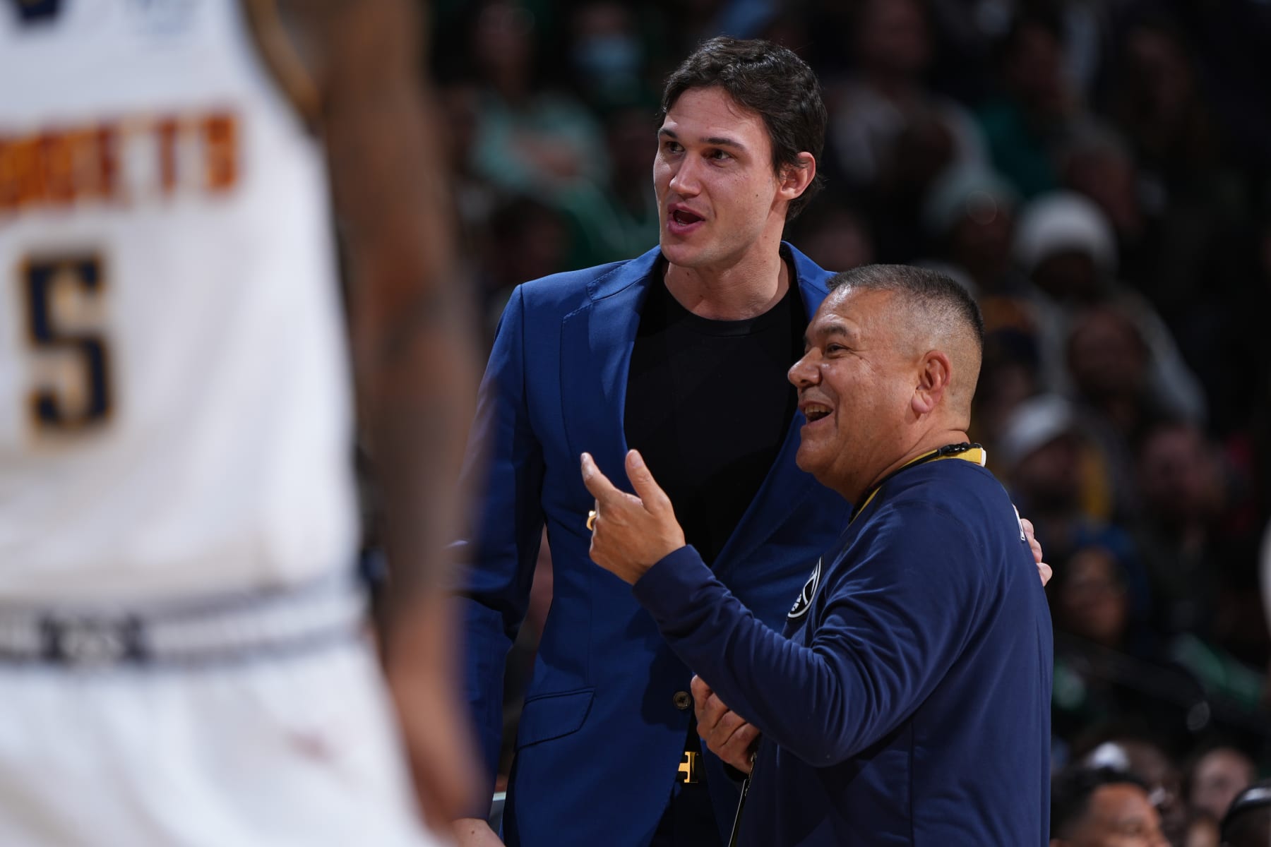 DENVER, CO - JANUARY 1: Former Denver Nuggets player Danilo Gallinari #8 of the Boston Celtics talks with Equipment Manager Sparky Gonzales of the Denver Nuggets on January 1, 2023 at the Ball Arena in Denver, Colorado. NOTE TO USER: User expressly acknowledges and agrees that, by downloading and/or using this Photograph, user is consenting to the terms and conditions of the Getty Images License Agreement. Mandatory Copyright Notice: Copyright 2022 NBAE (Photo by Garrett Ellwood/NBAE via Getty Images)