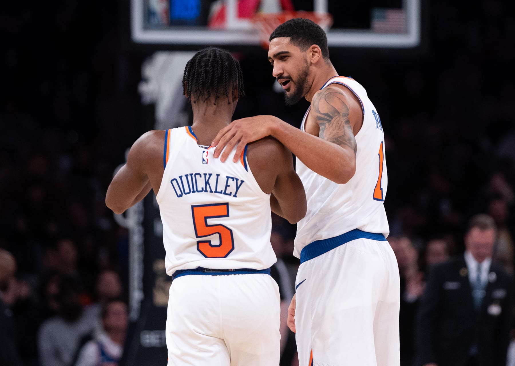 NEW YORK, NEW YORK - JANUARY 18: Obi Toppin #1 speaks with Immanuel Quickley #5 of the New York Knicks during the fourth quarter of the game against the Washington Wizards at Madison Square Garden on January 18, 2023 in New York City. NOTE TO USER: User expressly acknowledges and agrees that, by downloading and or using this photograph, User is consenting to the terms and conditions of the Getty Images License Agreement. (Photo by Dustin Satloff/Getty Images)